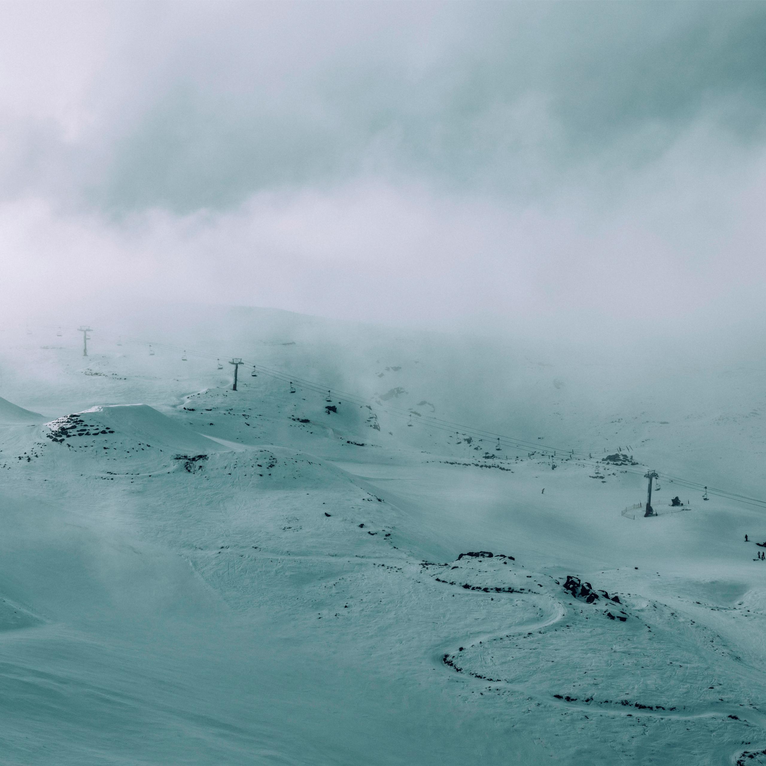 Foggy mountainside of ski runs in New Zealand