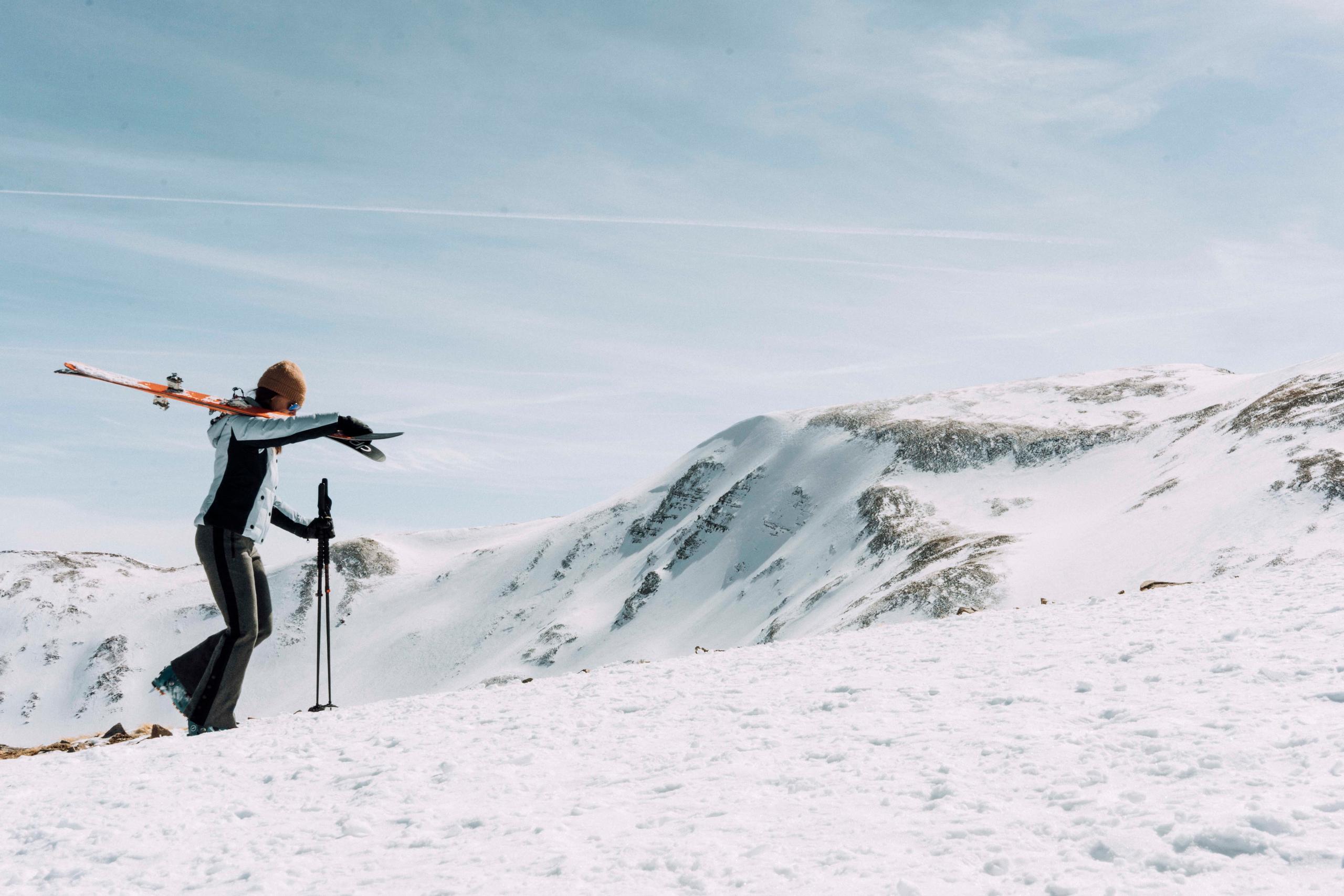 Women in W Torino Jacket skinning up snow mountain