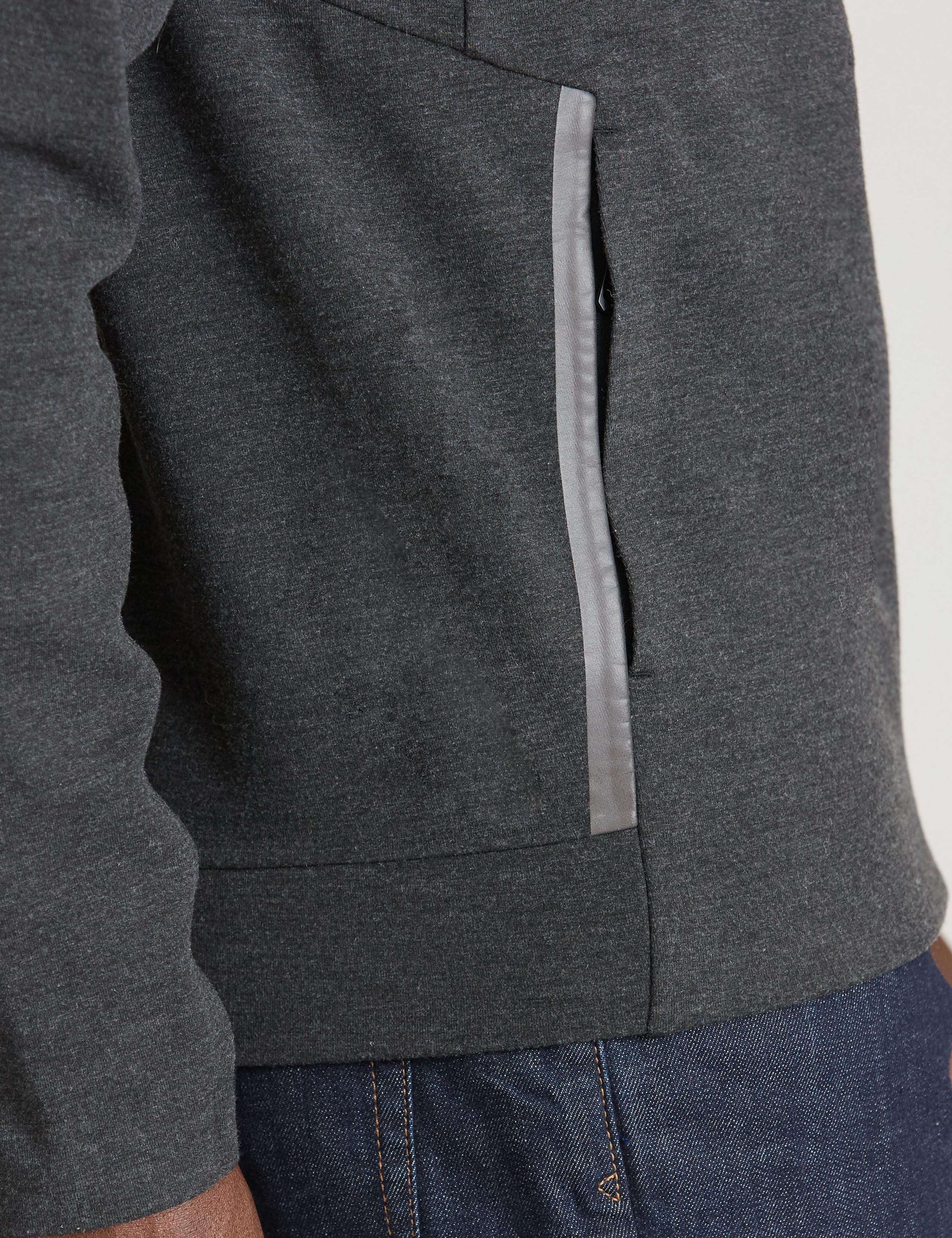 Detail of side pockets of man wearing Forge Hoodie