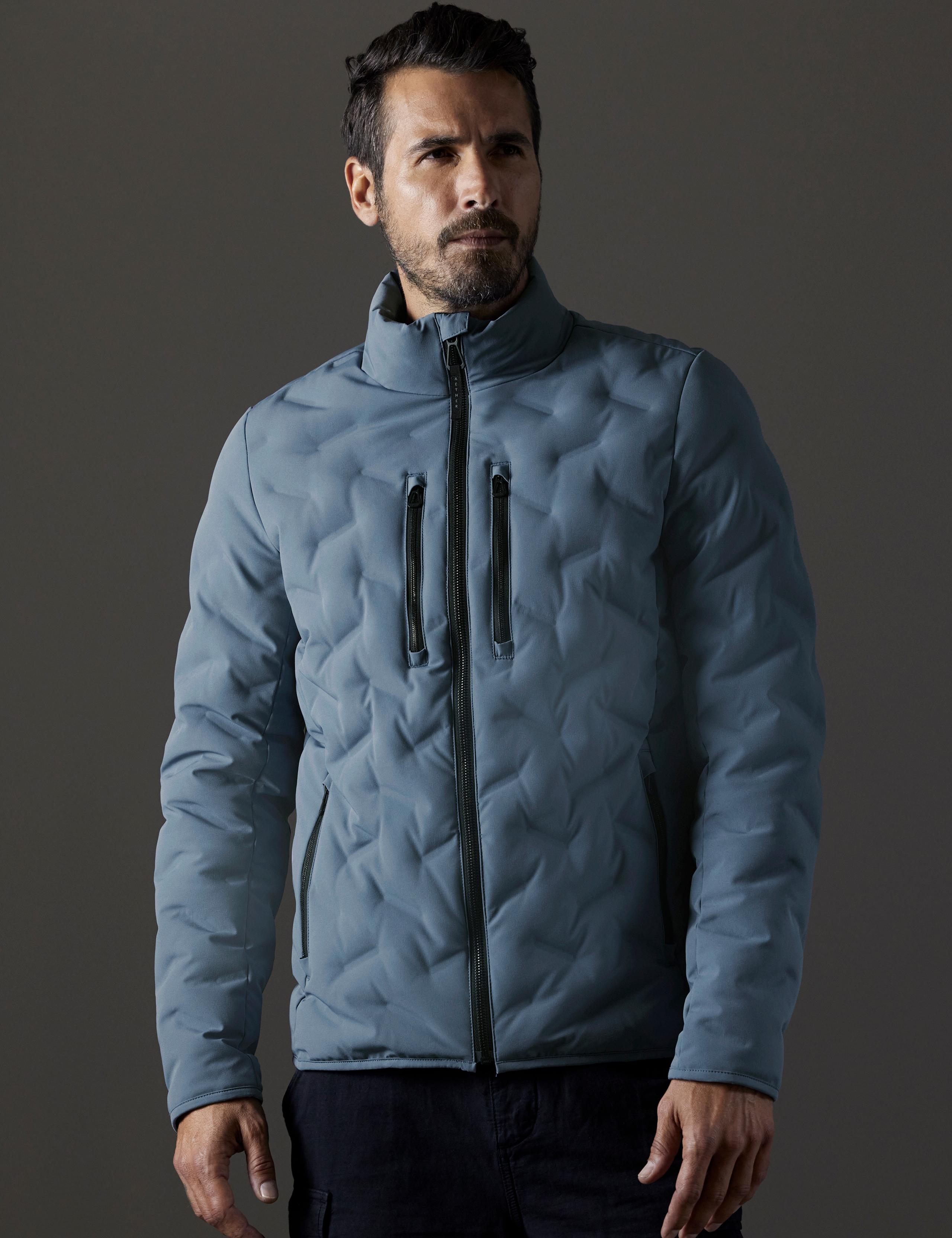 Front view of man wearing Rex Down Jacket in Portal Blue