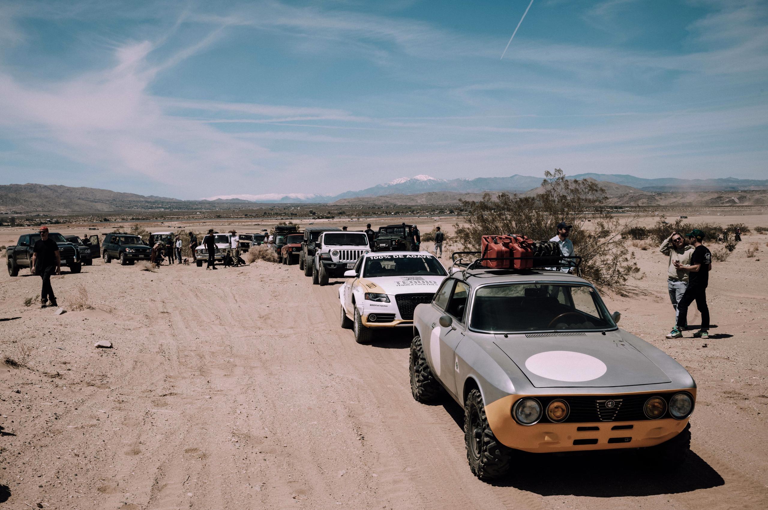 Cars and people during Aether Rally in Joshua Tree National Park