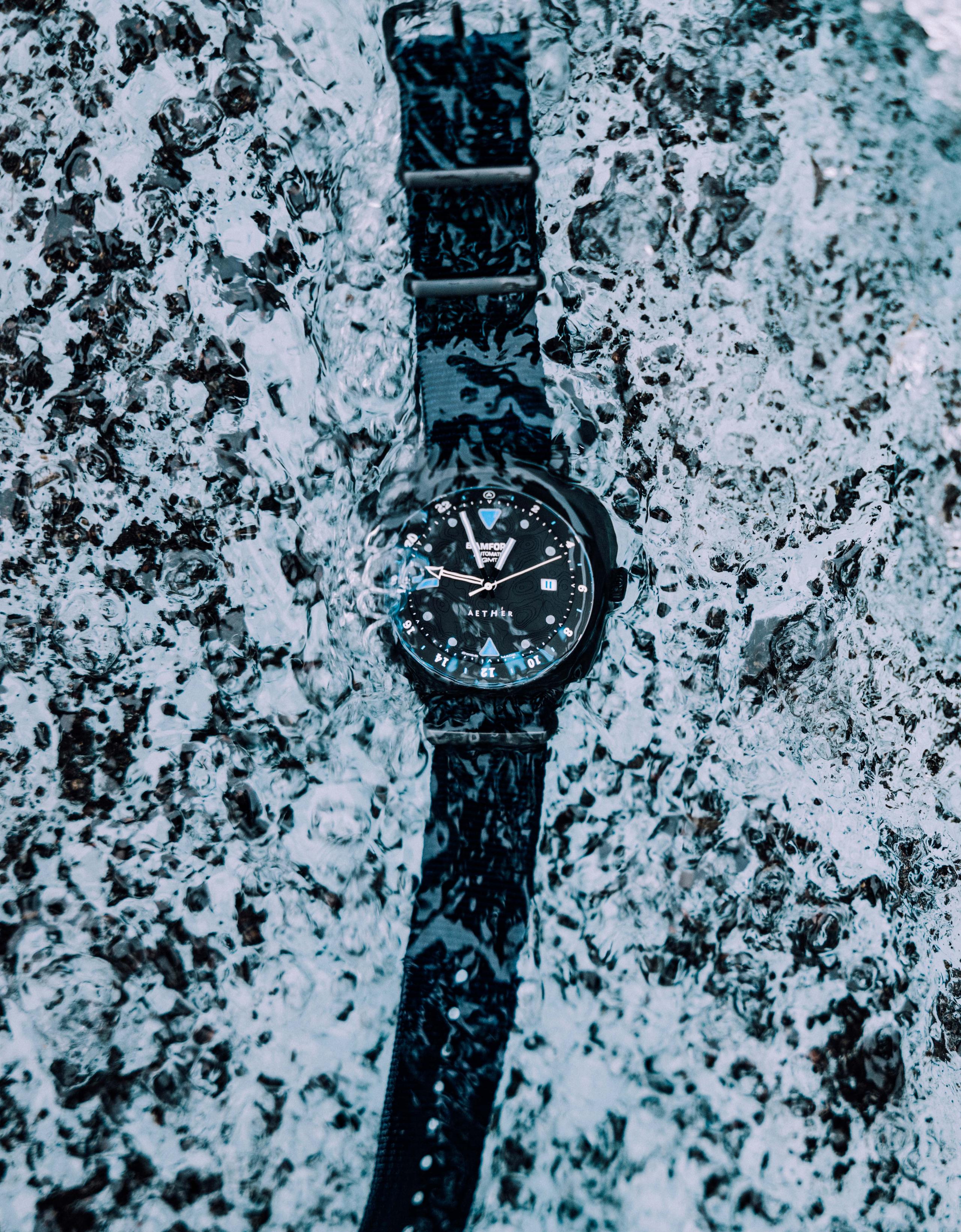 Bamford watch under river water in Iceland