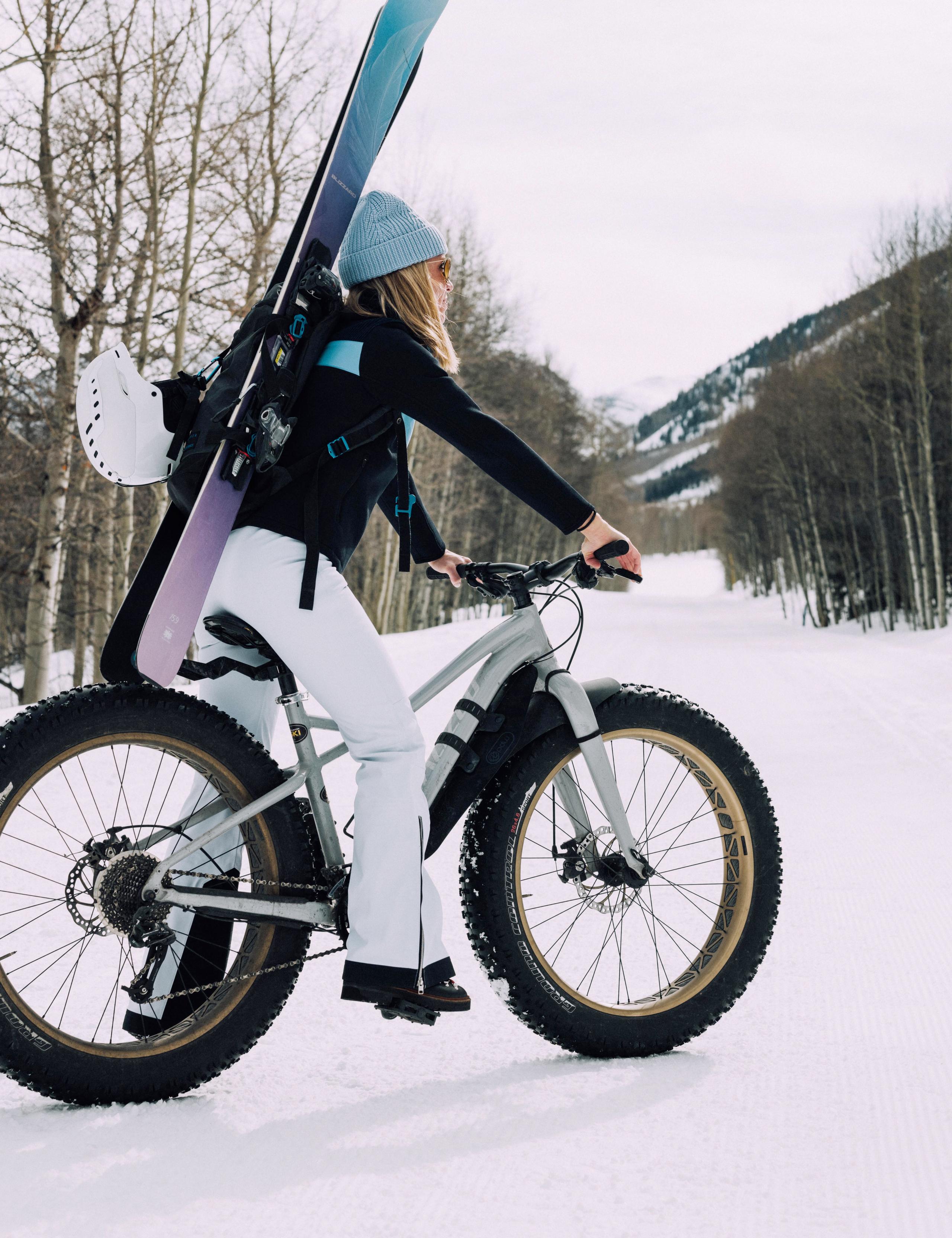 Women in ski outfit on a fat tire bicycle