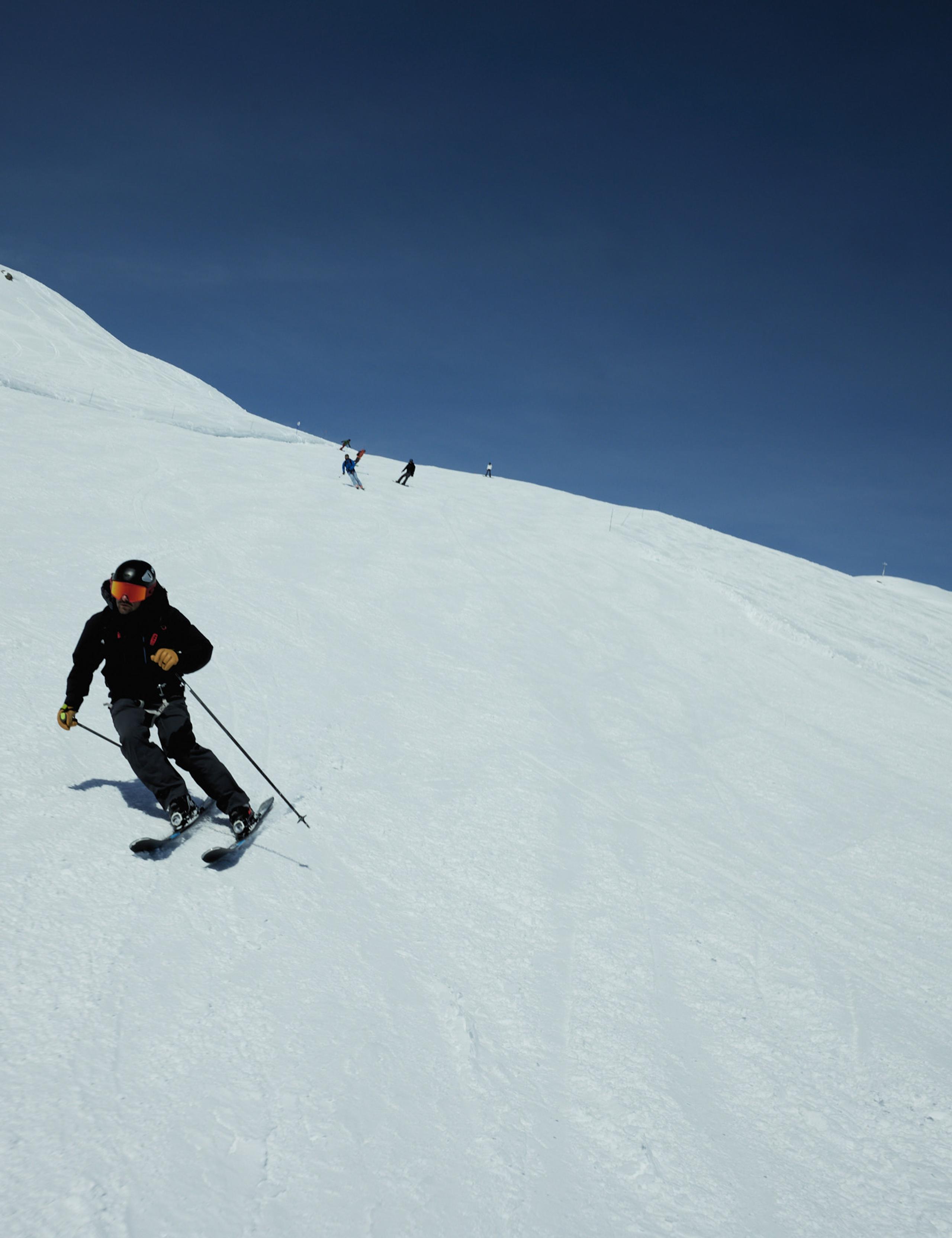 Man skiing down hill in French Alps