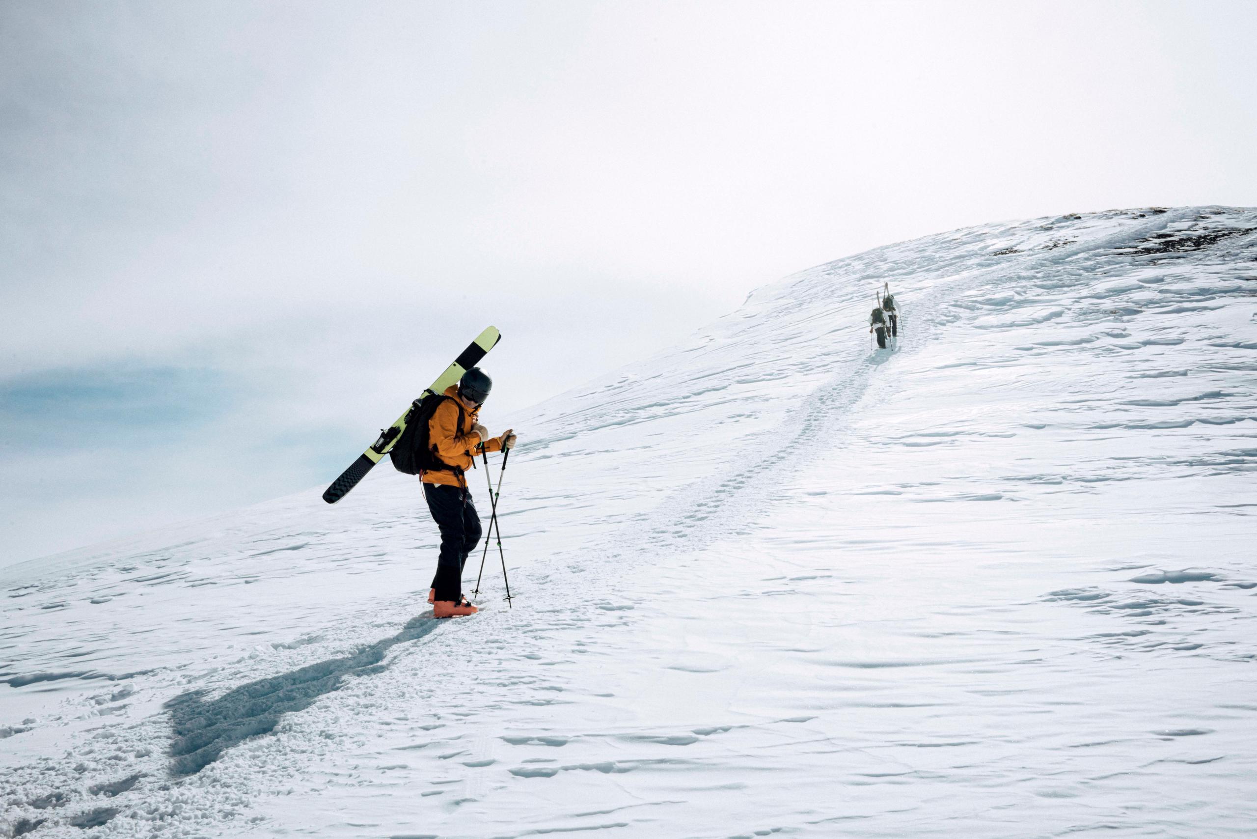 Skiiers hiking up mountain in Silverton, Colorado
