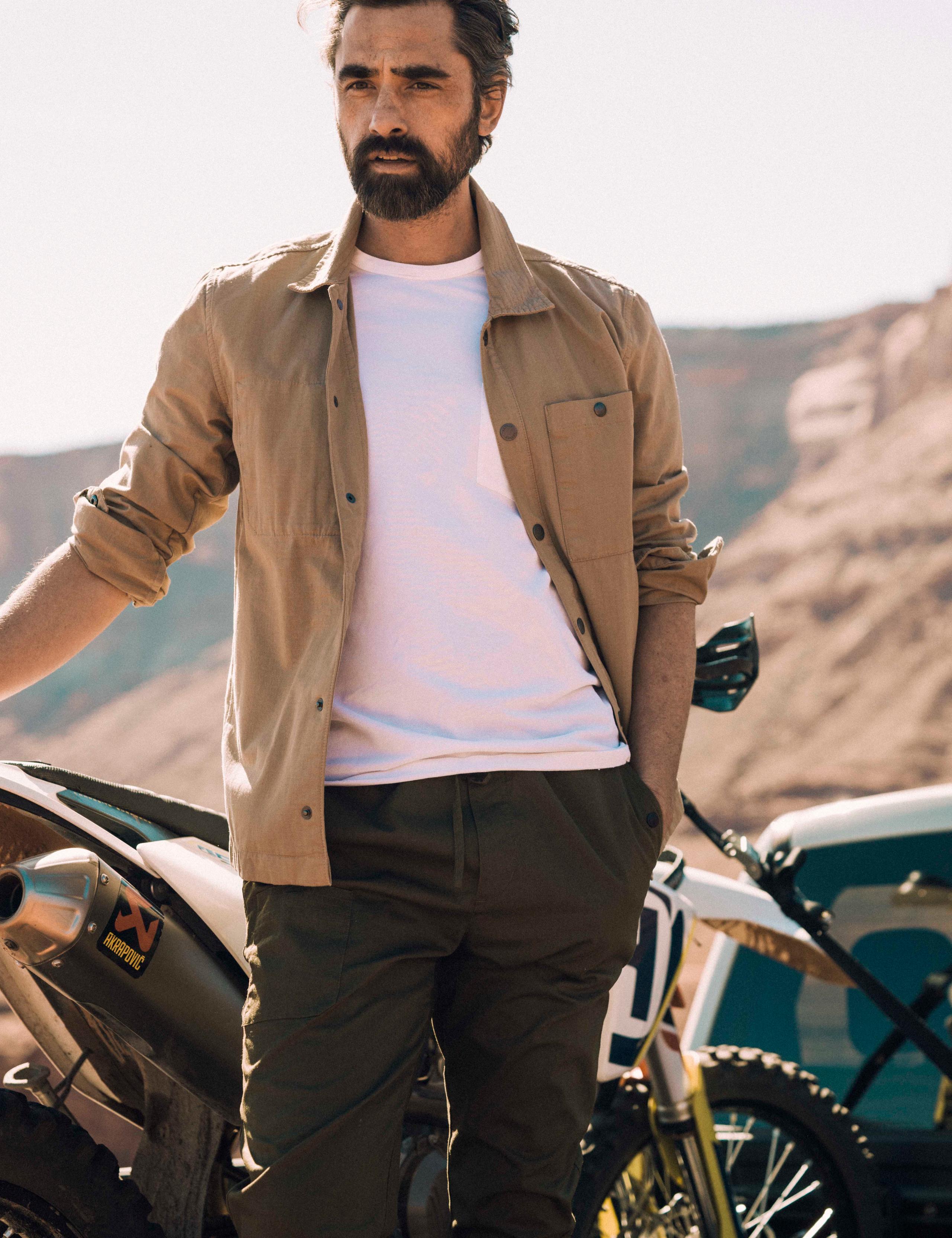 Man wearing Rapids Jacket in front of motorcycle in Moab, Utah