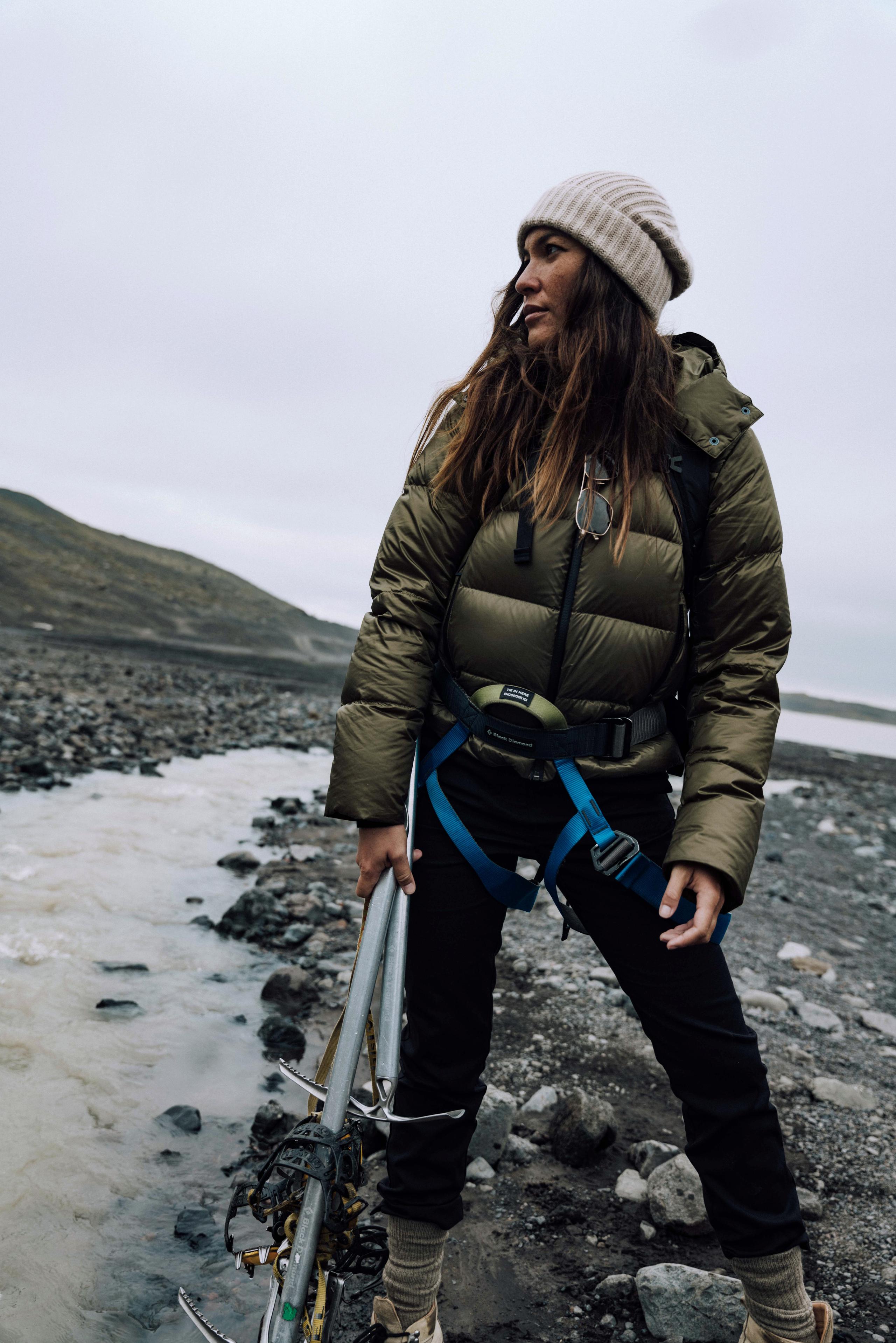 Man with hiking and ice climbing gear in hand