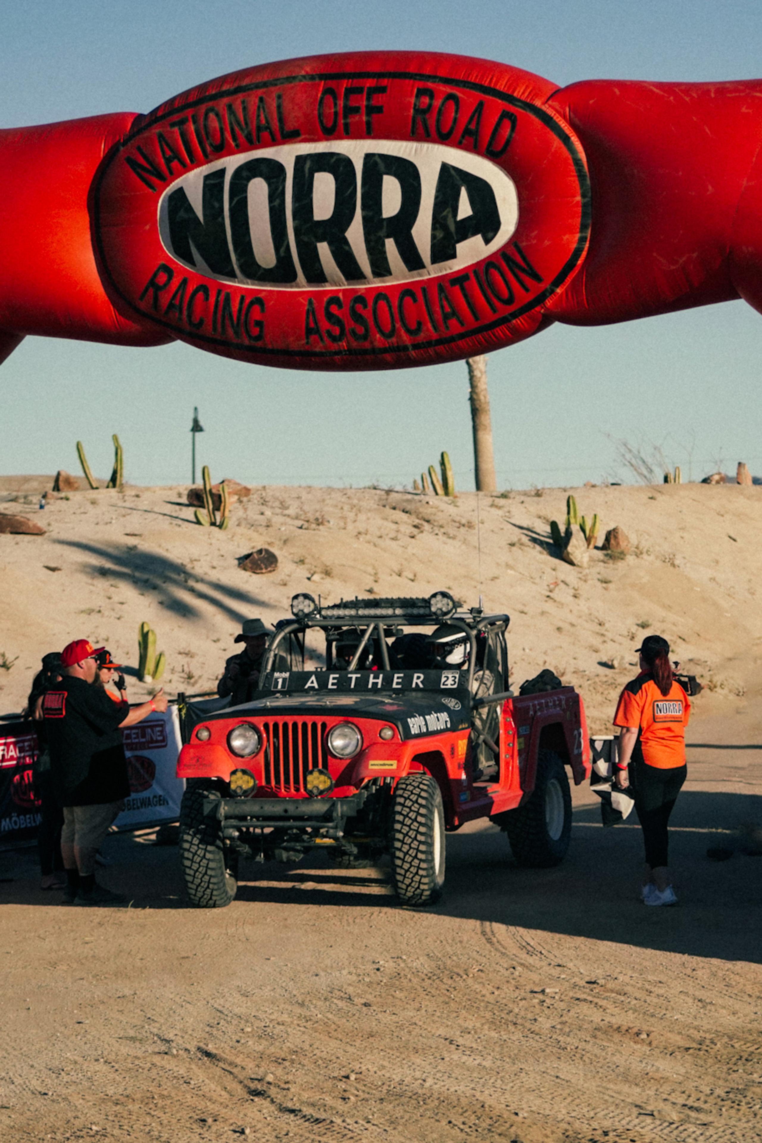 NORRA signage above 1969 Jeep Commando at race start