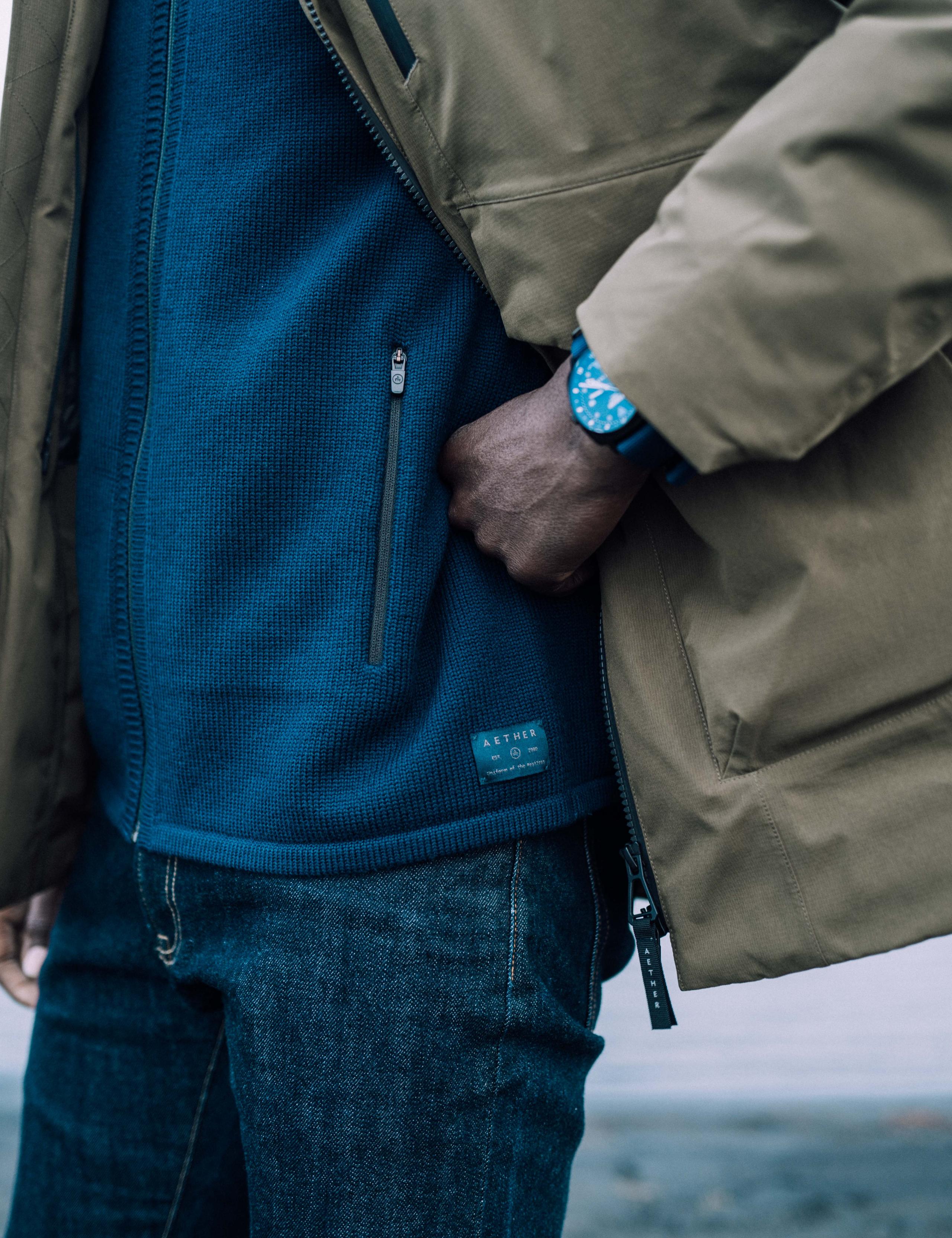 Detailed shot of the Riley Sweater pocket zipper.