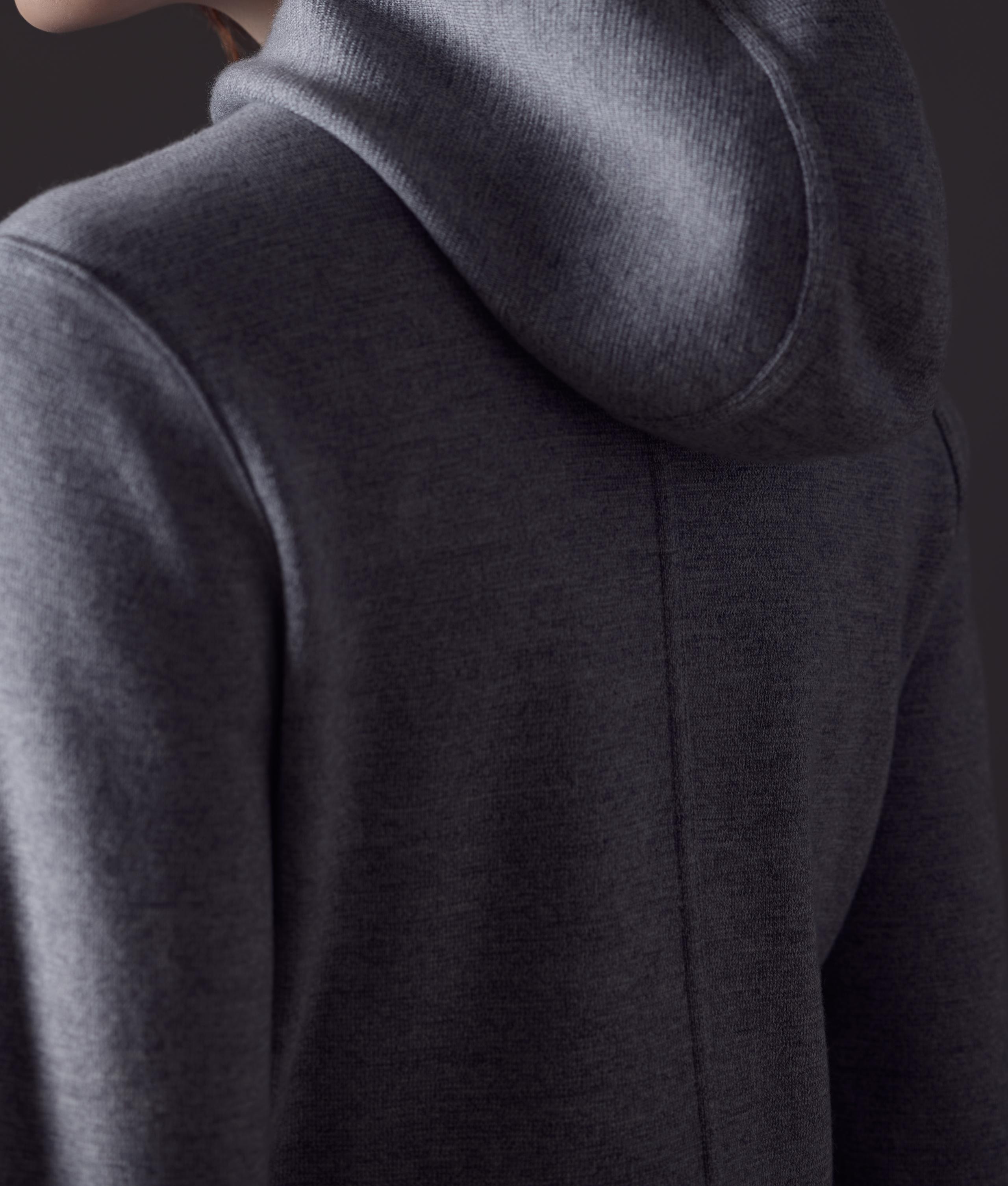 Close-up photo of the AETHER Riley Full-Zip Sweater.
