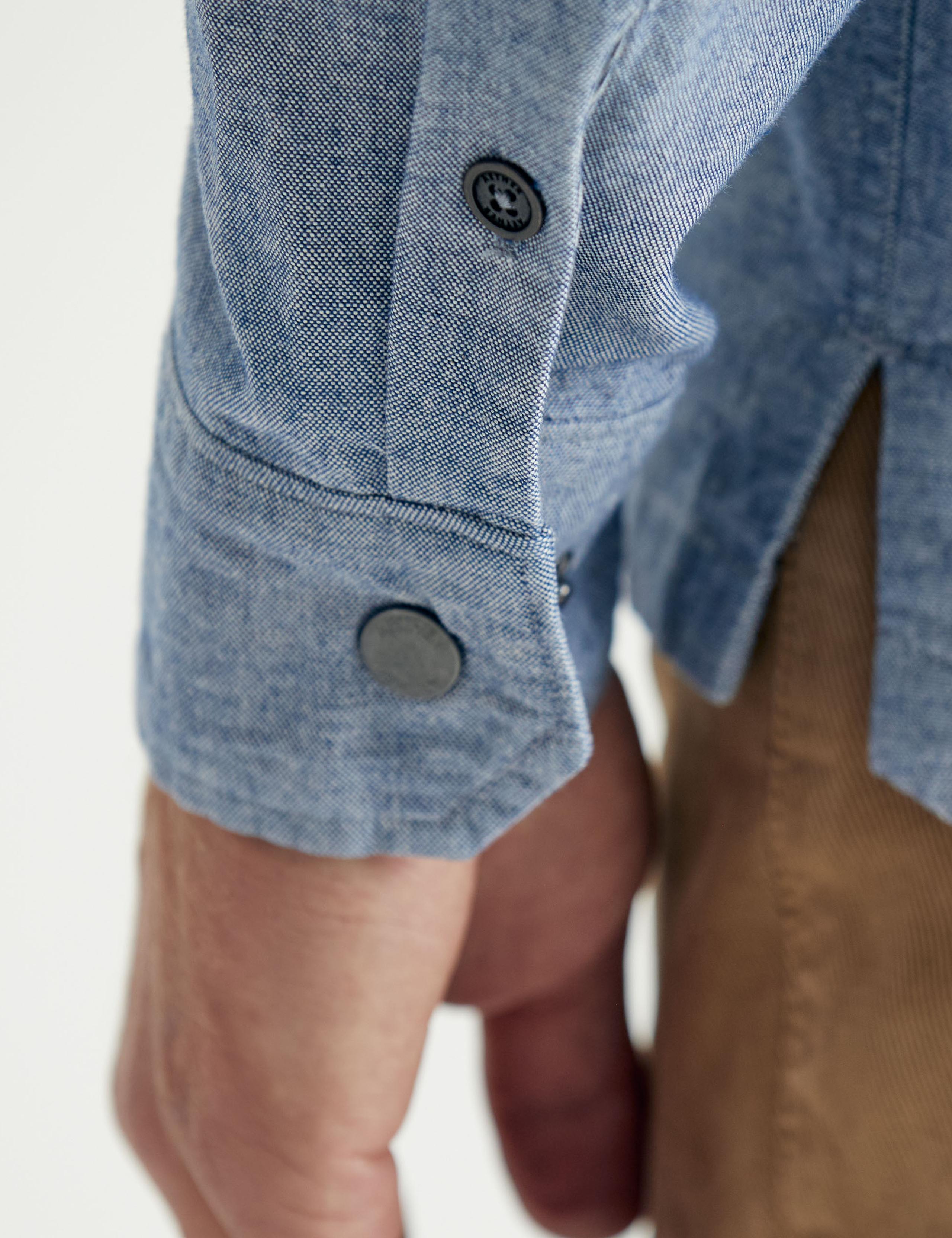 Detail of sleeve cuff of man wearing Chambray Button-DOwn