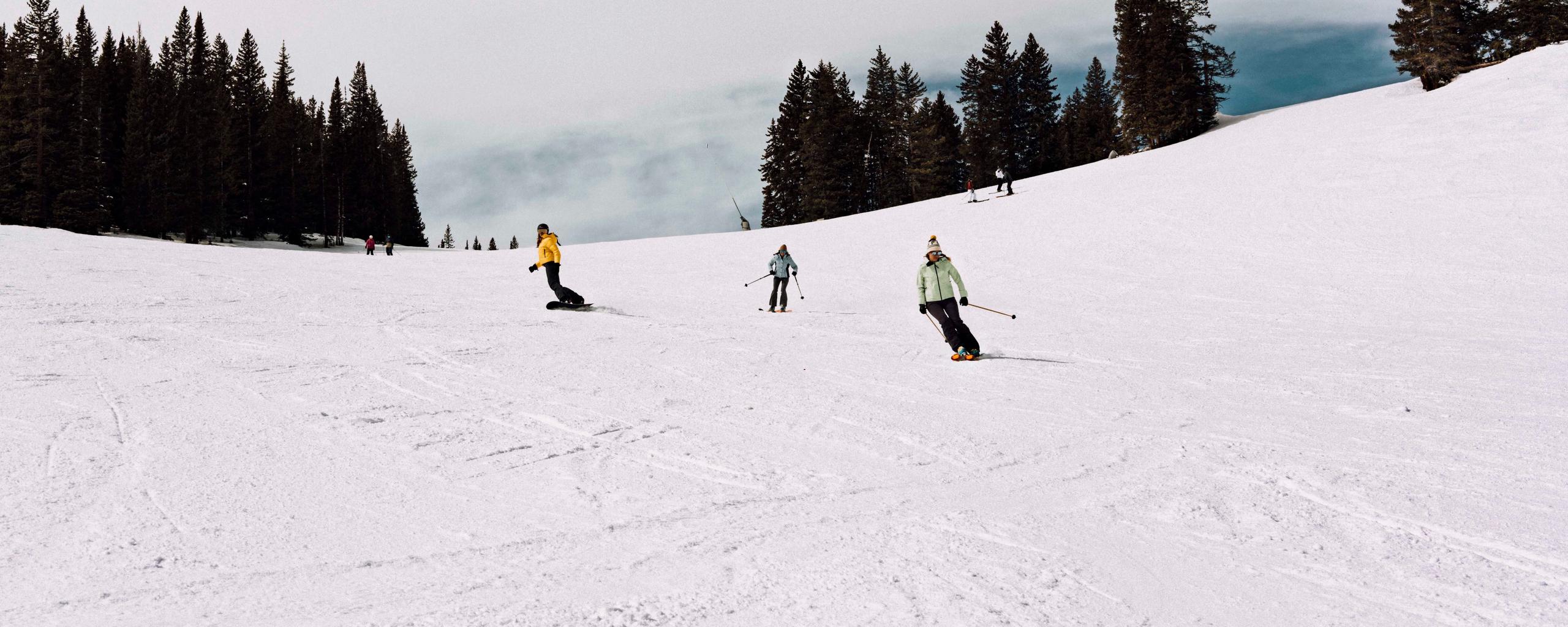 Girls skiing down a mountain