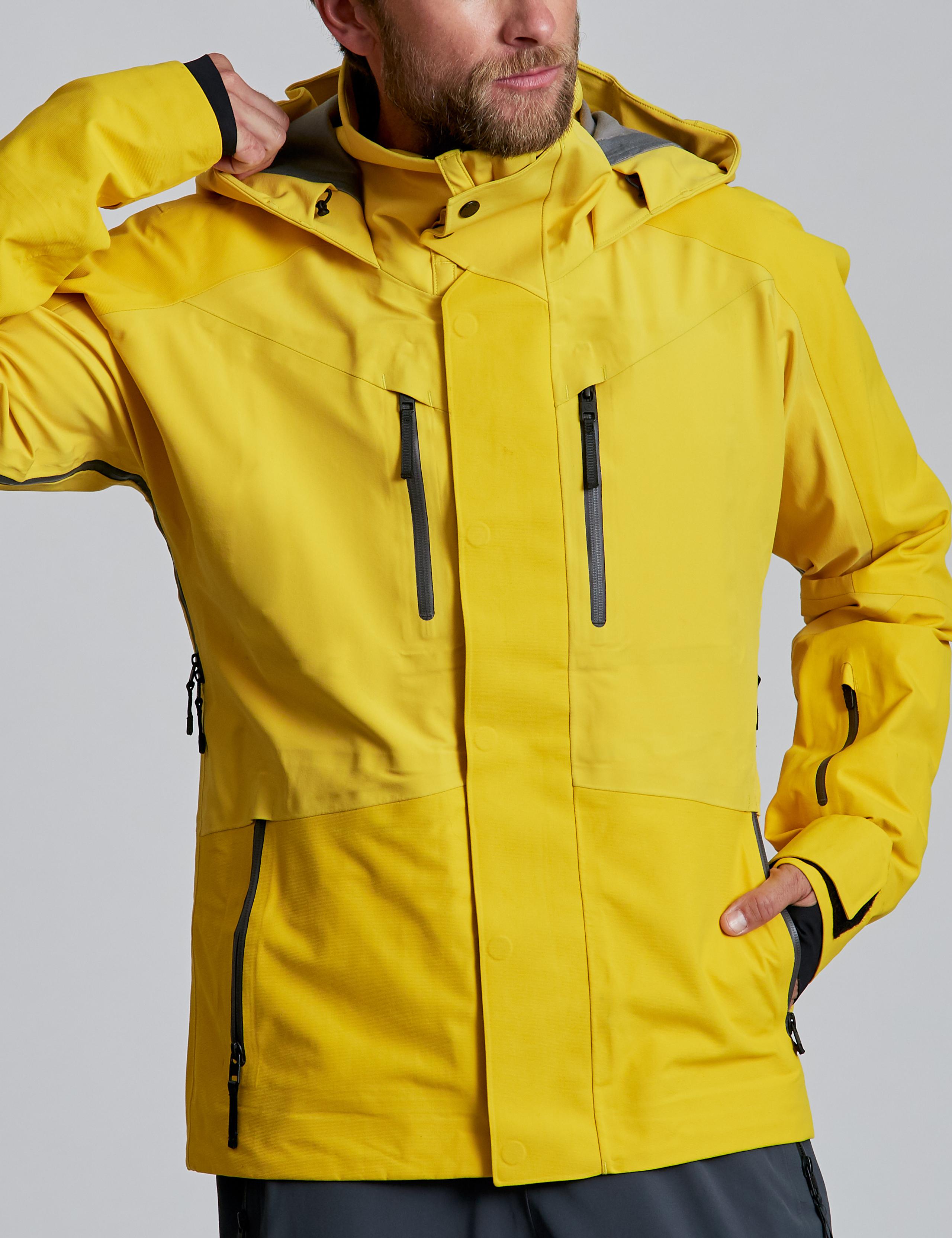 Man wearing Stealth Snow Jacket in Solar Yellow in studio