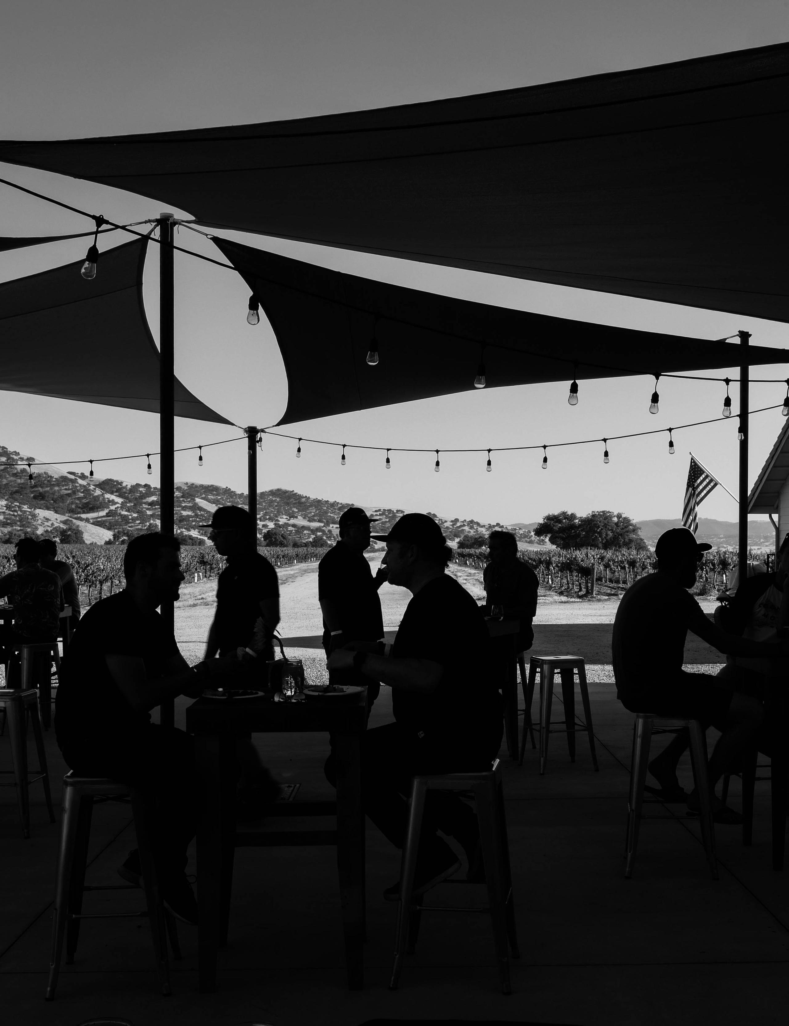 Black and white photo of attendees dining