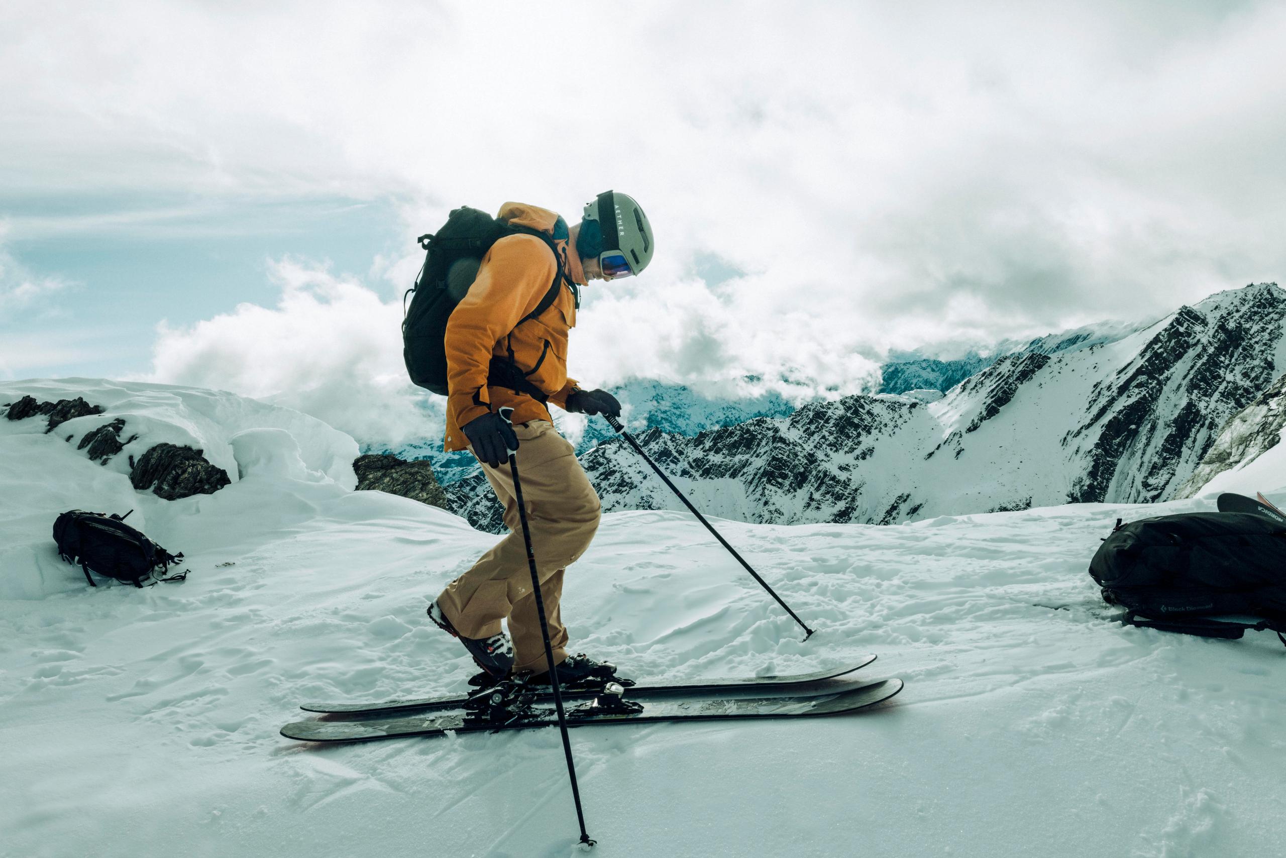 Men getting ready to ski down the hill in New Zealnd. 