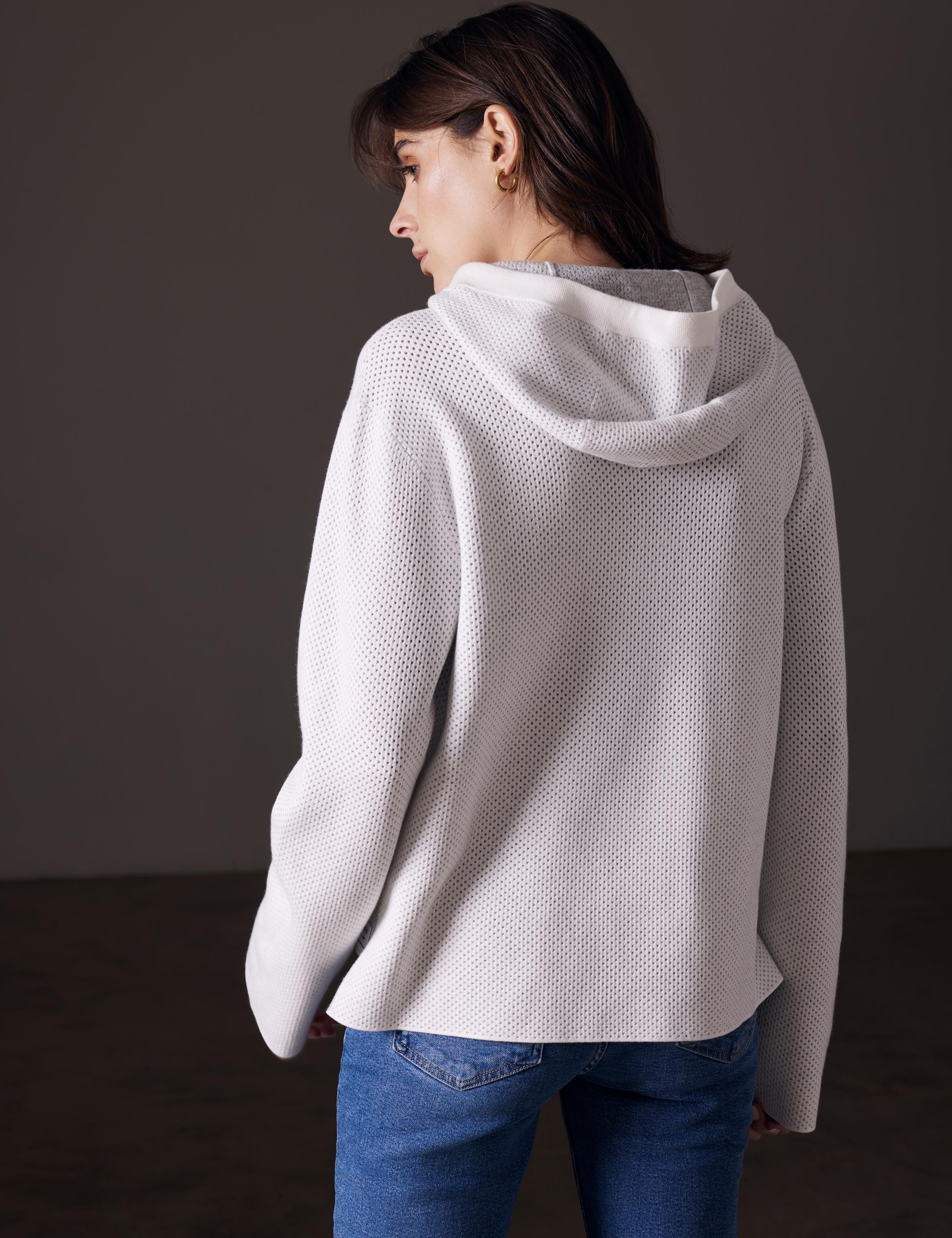 back view of woman wearing baja mesh sweater