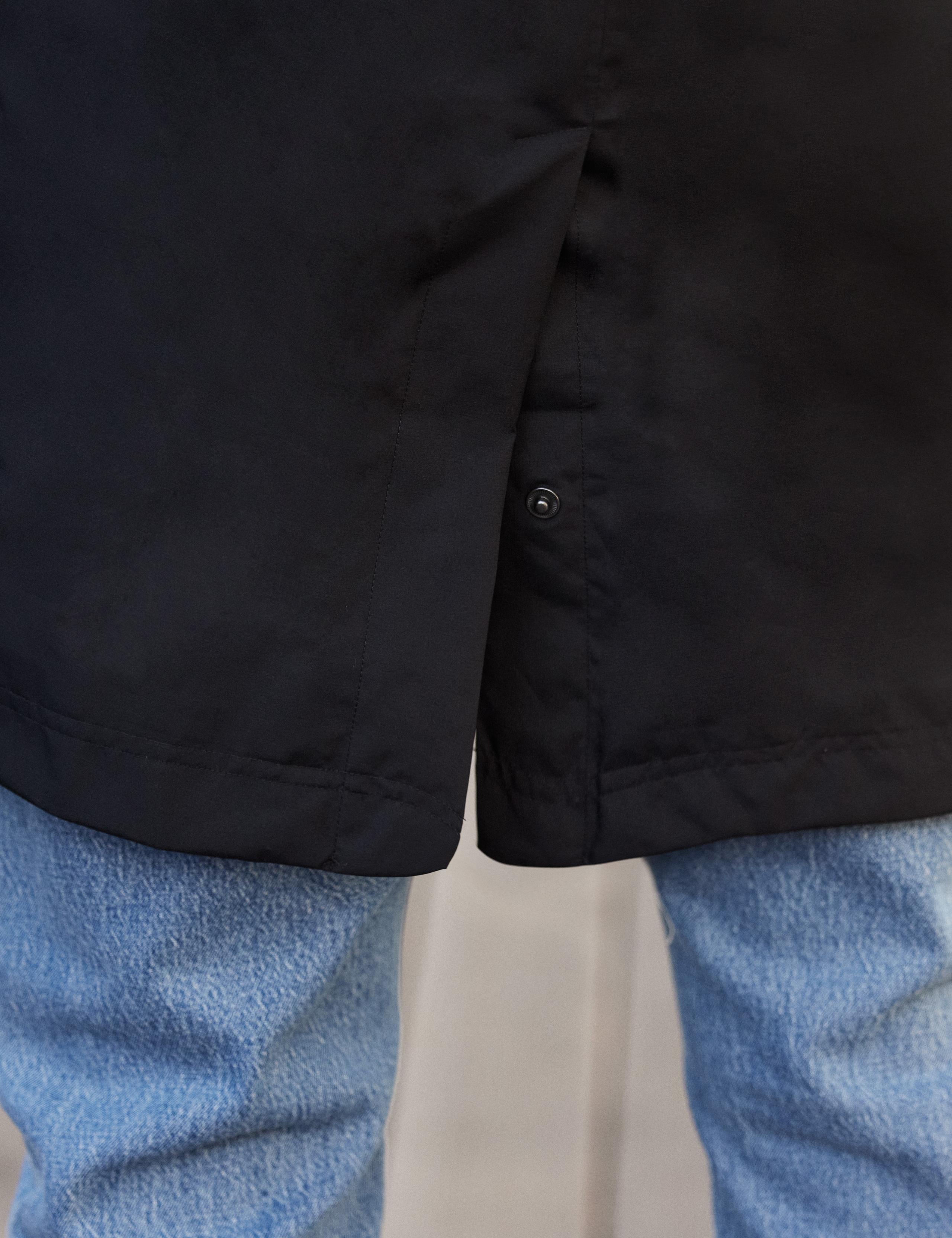 Detail of front pocket of man wearing Tower Gore-Tex Raincoat
