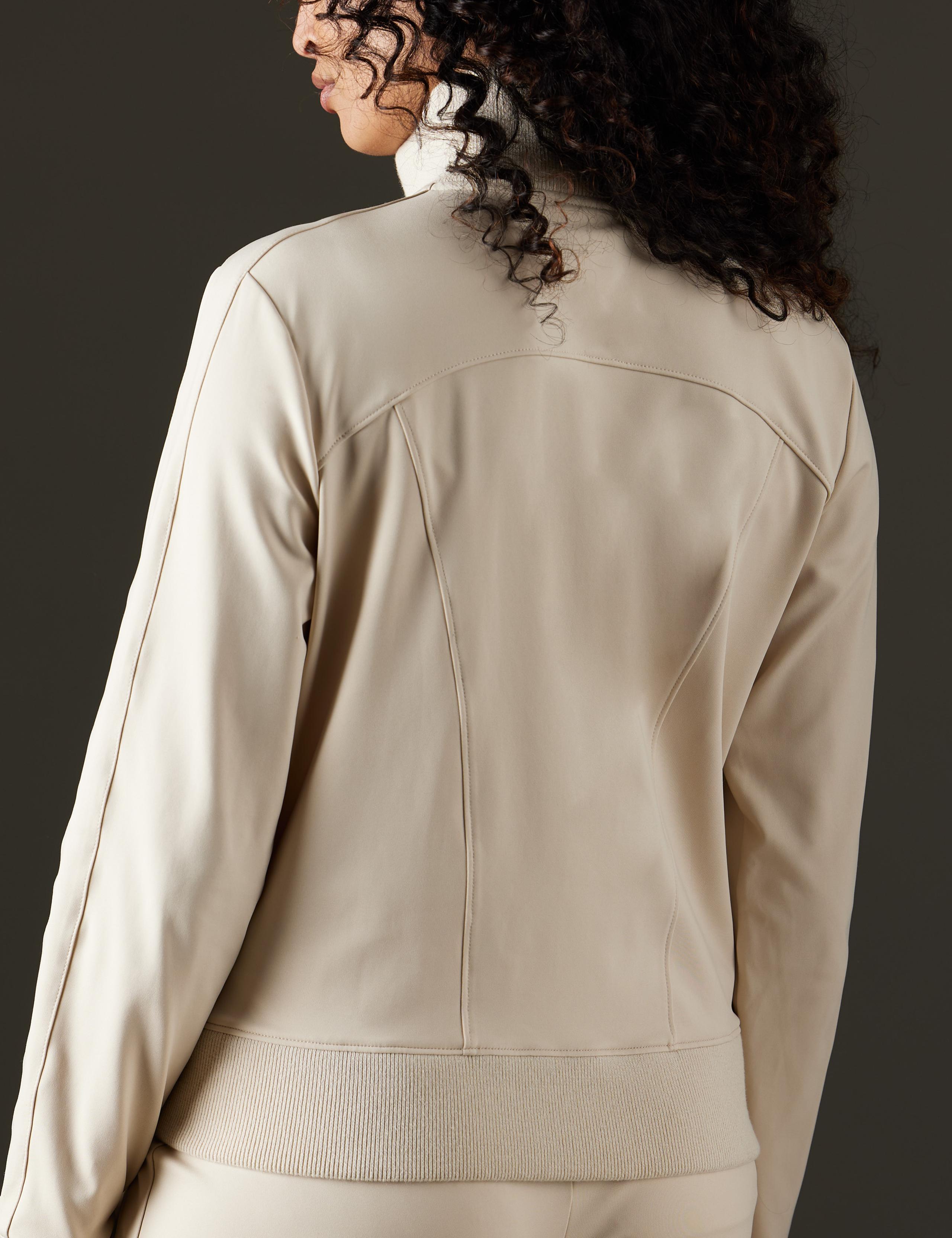 Back view of woman wearing Eloise Travel Jacket in Bone