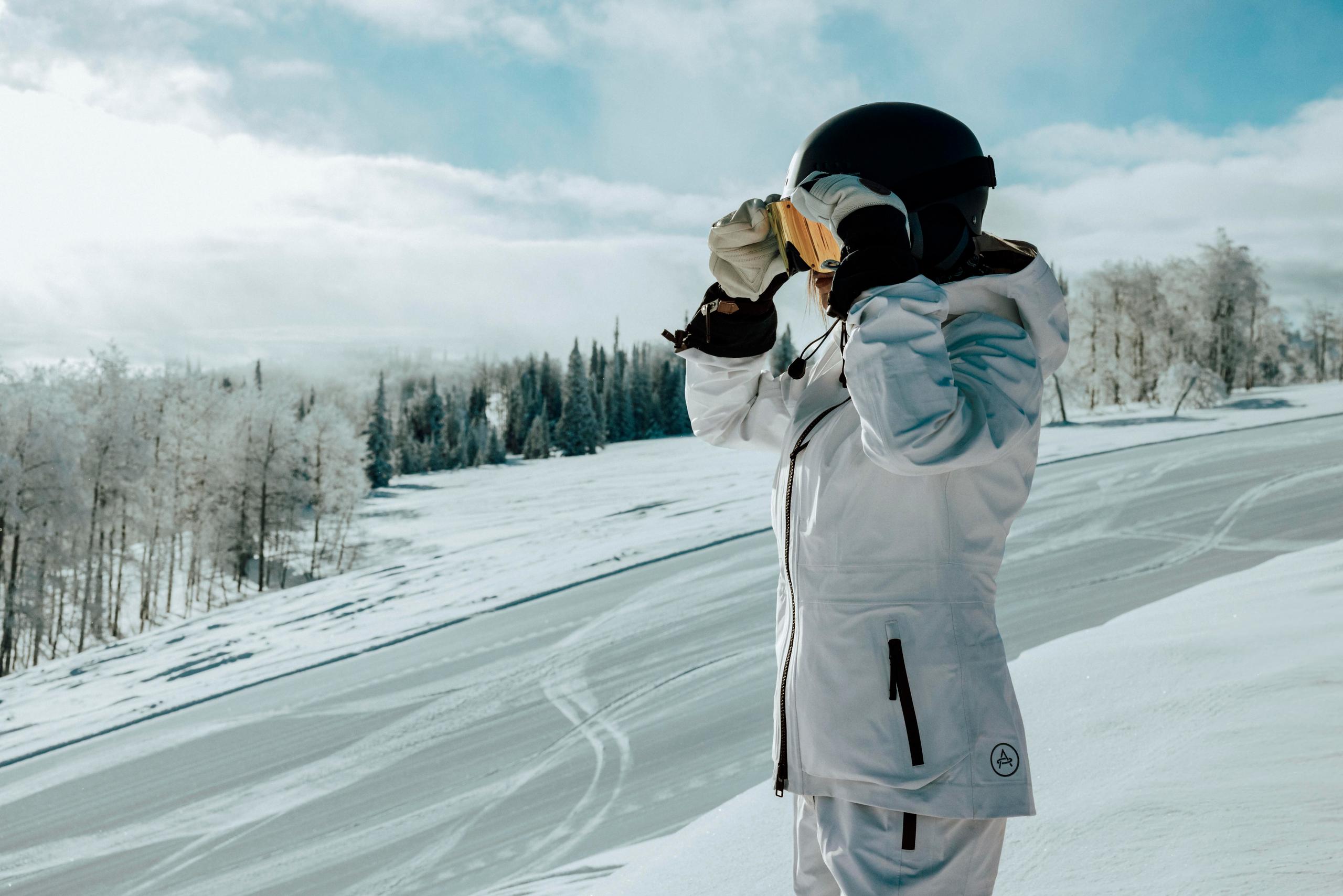 Woman adjusting goggles ready to ski down Utah Powder Mountain 