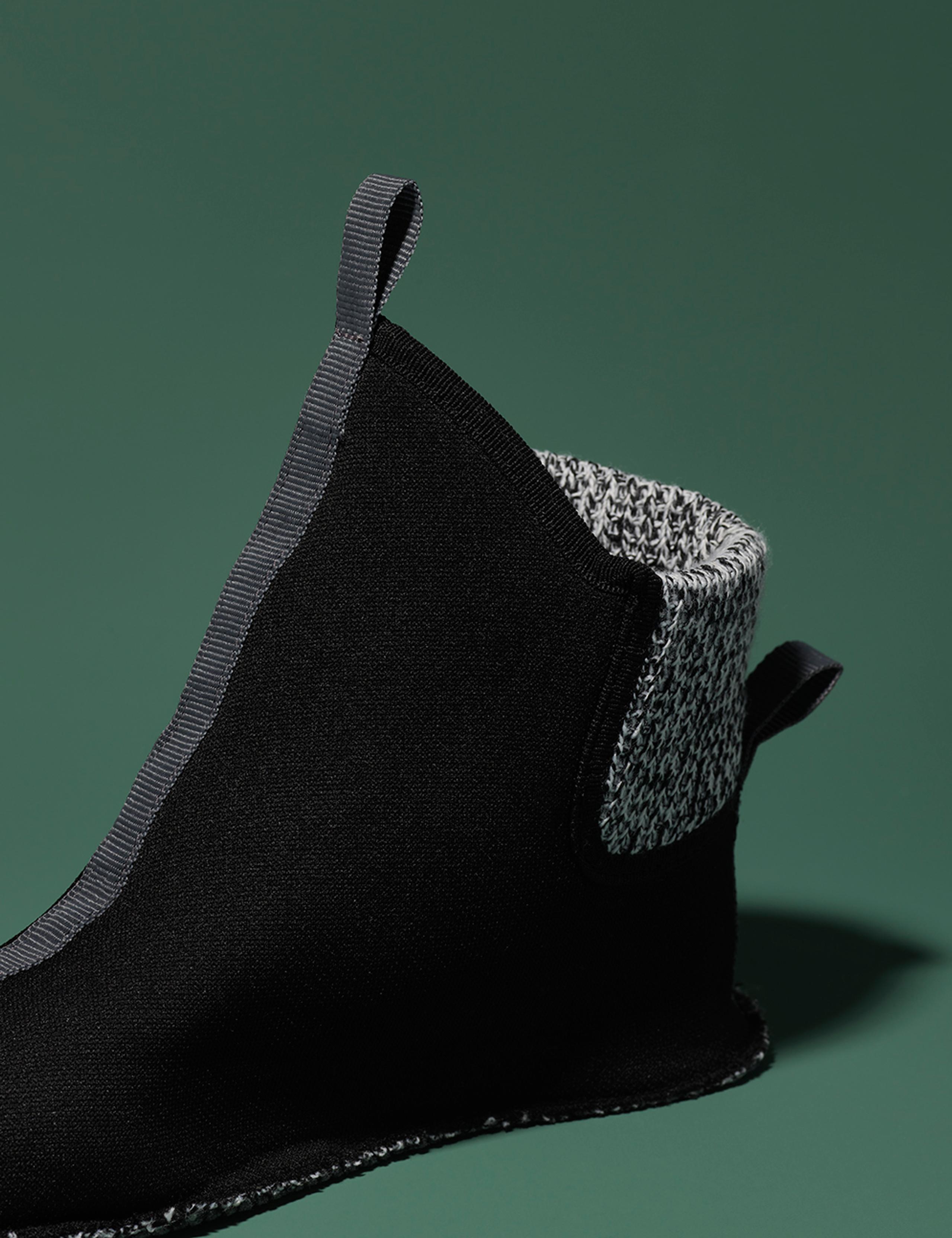 Removed sock bootie with neoprene outer shell