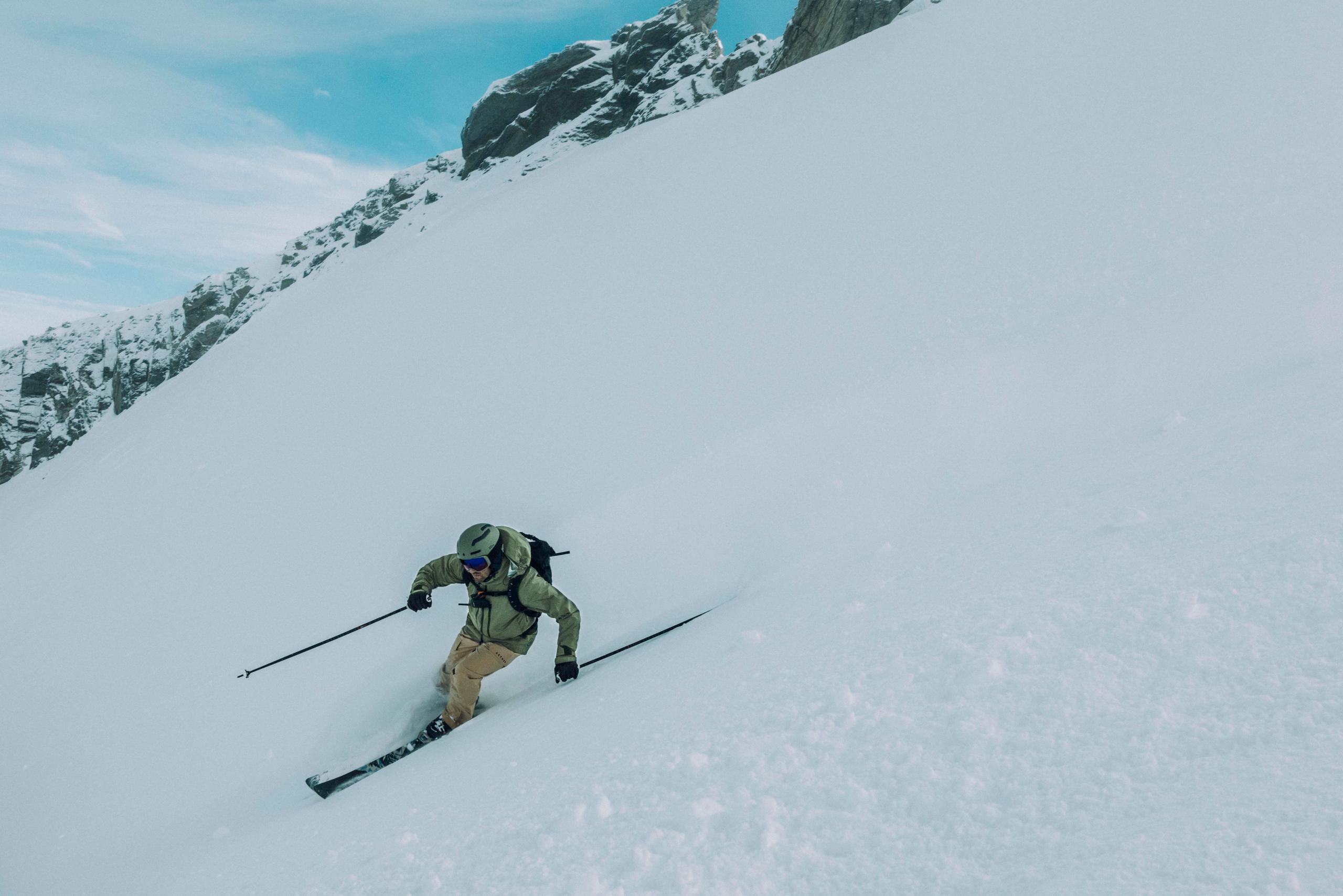 Men skiing down hill in New Zealand.