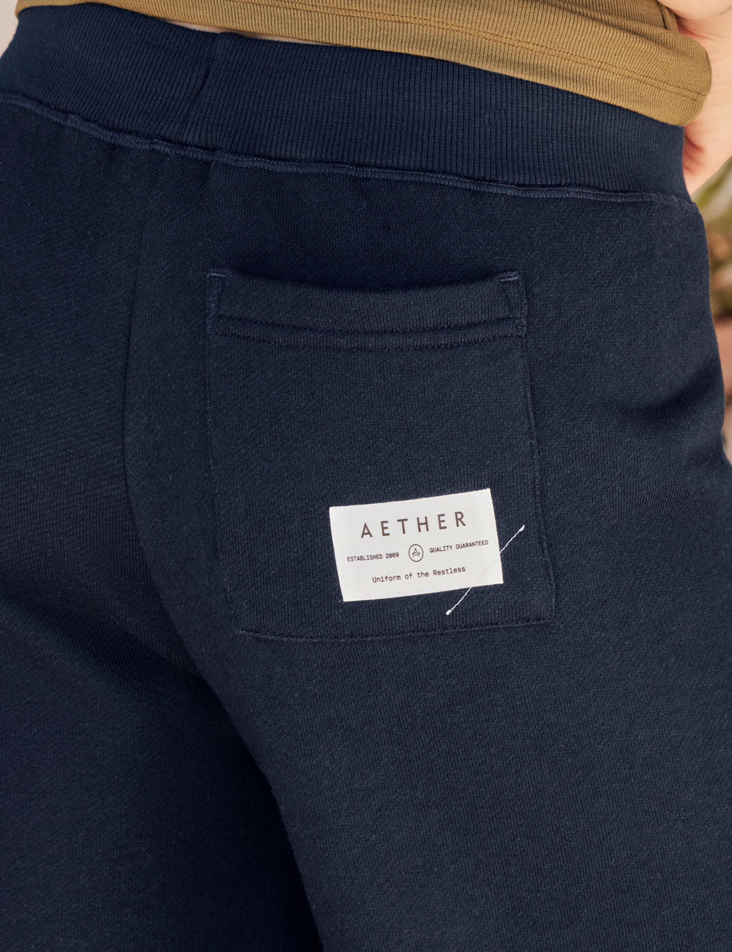 Closeup view of back pocket with AETHER woven patch label