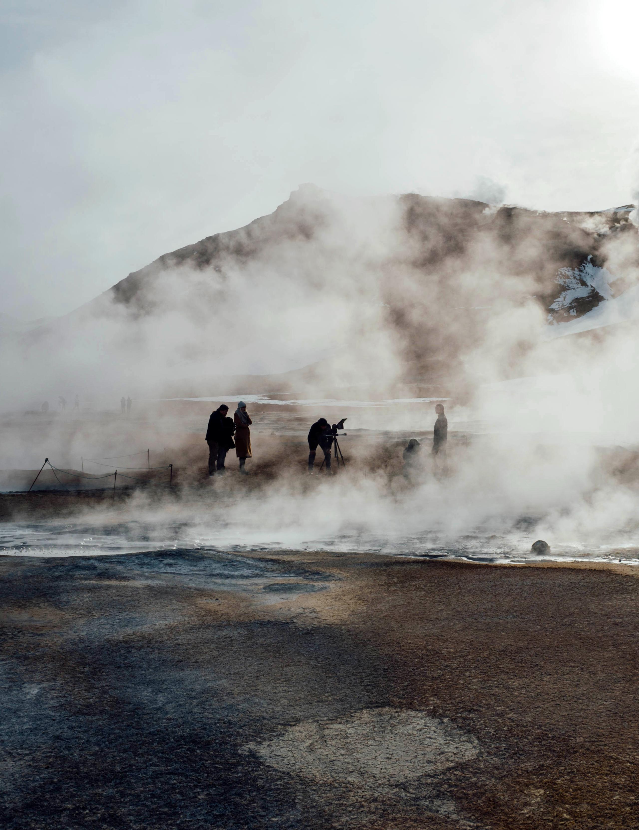 Behind-the-scenes of photoshoot in geothermal Iceland location with steam all around