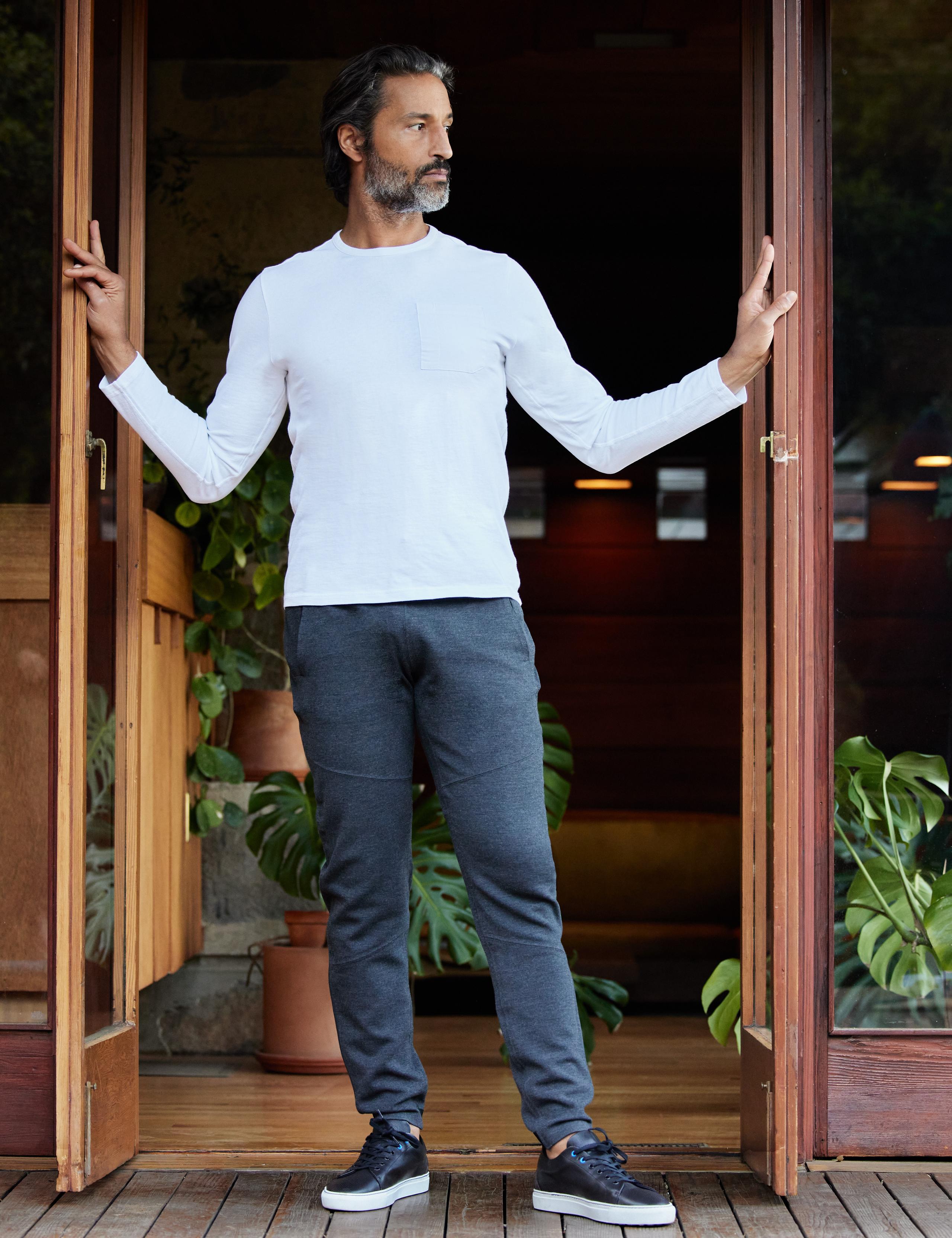 Man wearing Laurentic Long-Sleeve Crew standing at door in mid-century home