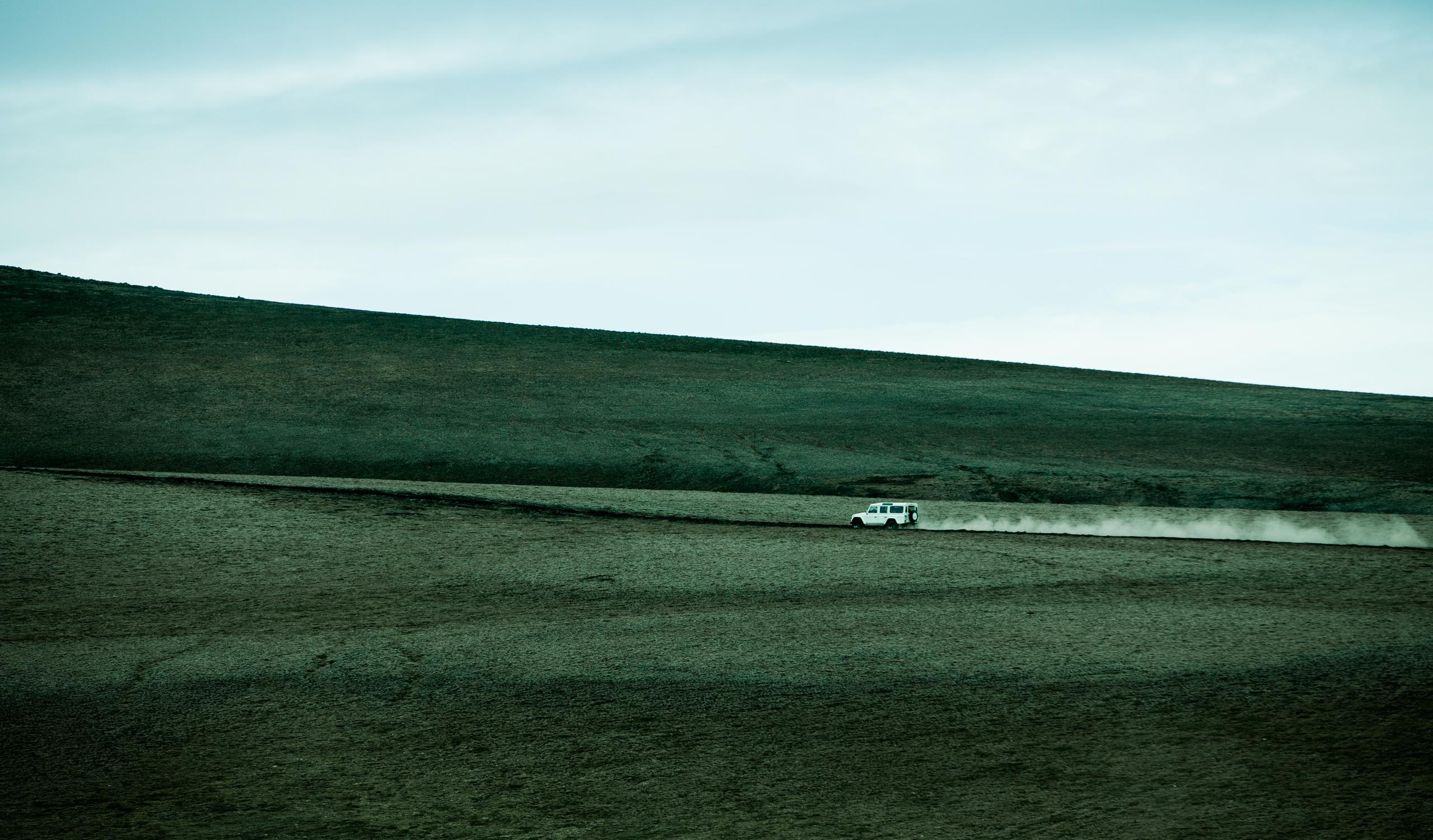 A car driving through field in Iceland