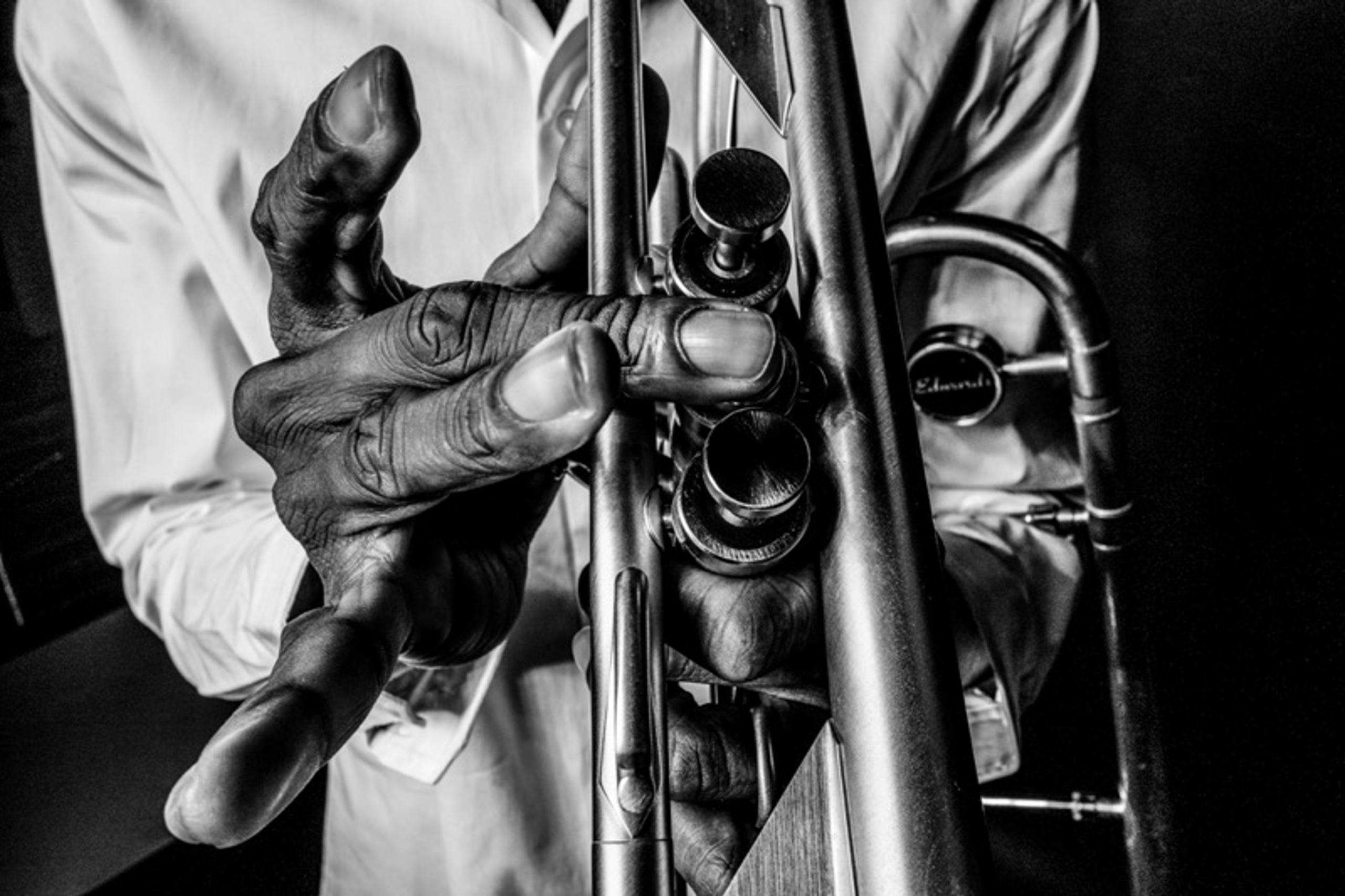 Closeup of Trombone Shorty's hands playing the trombone