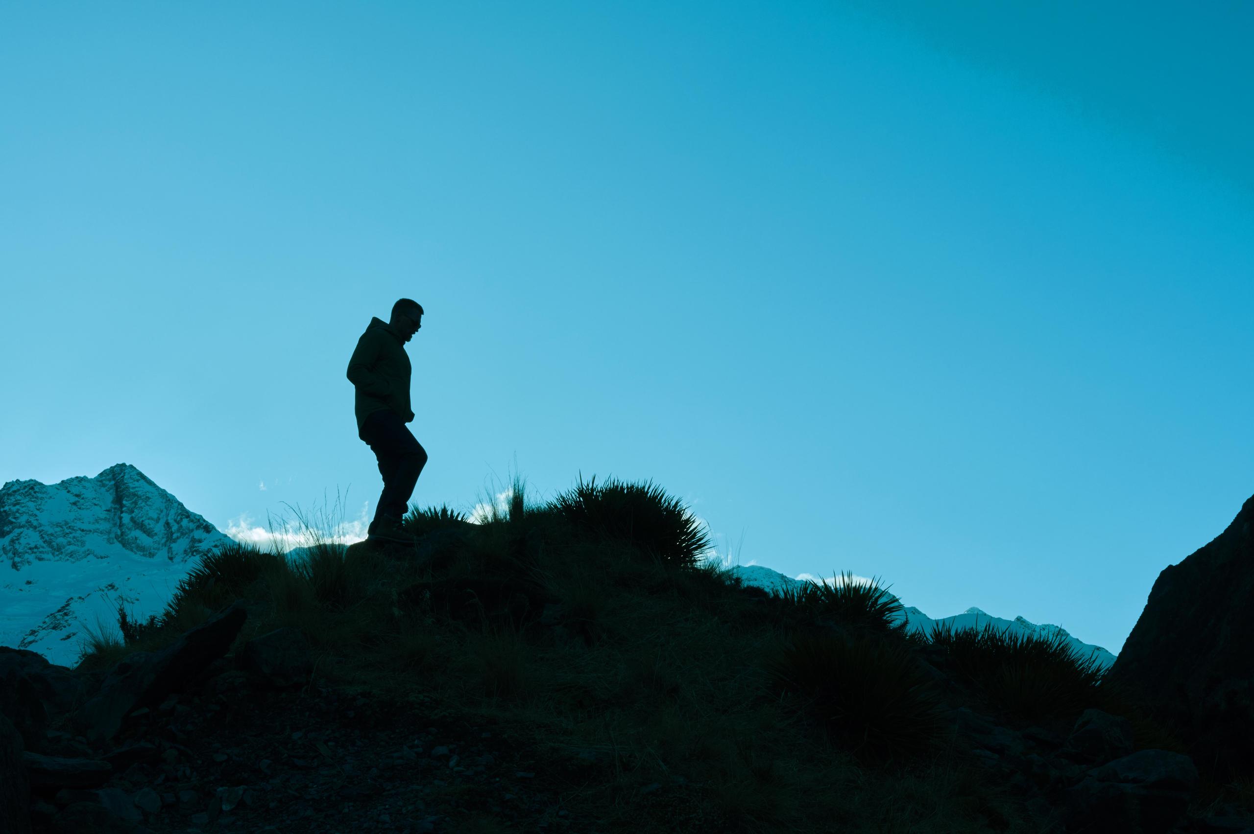 Men walking on a hill.