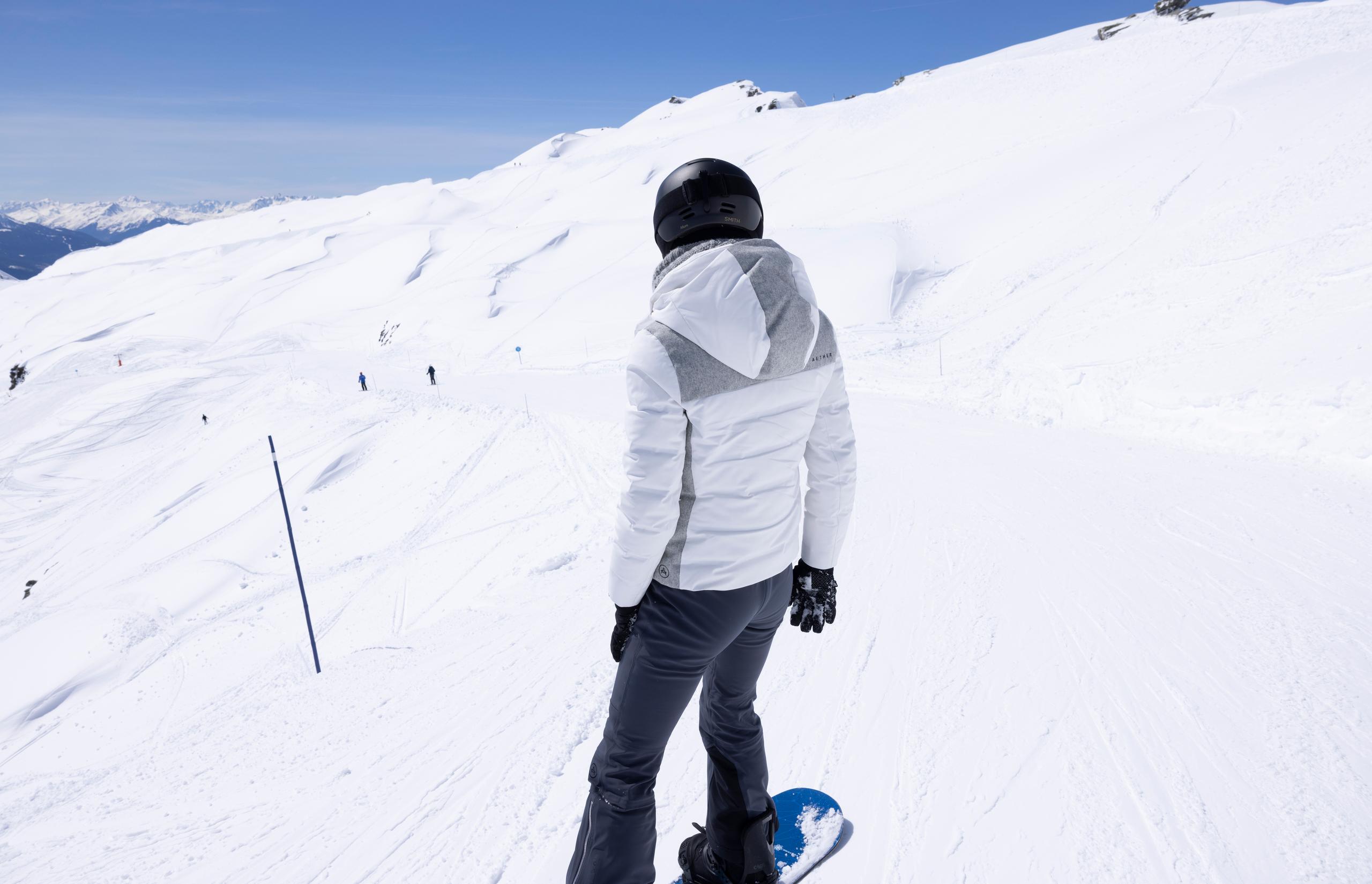 Women weraing Descent Snow Bib 2.0 on snow