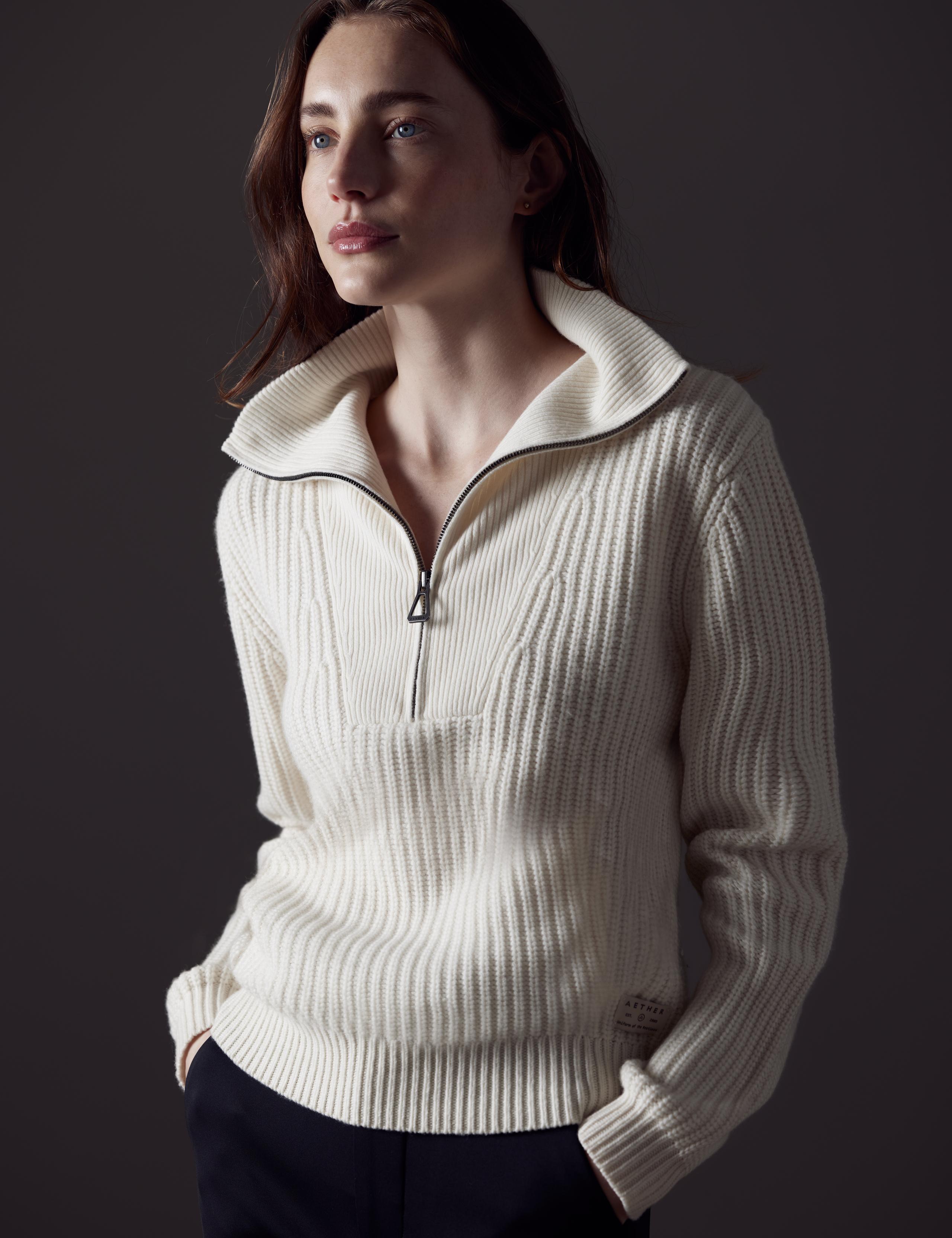 Woman in studio wearing the David Half-Zip Sweater