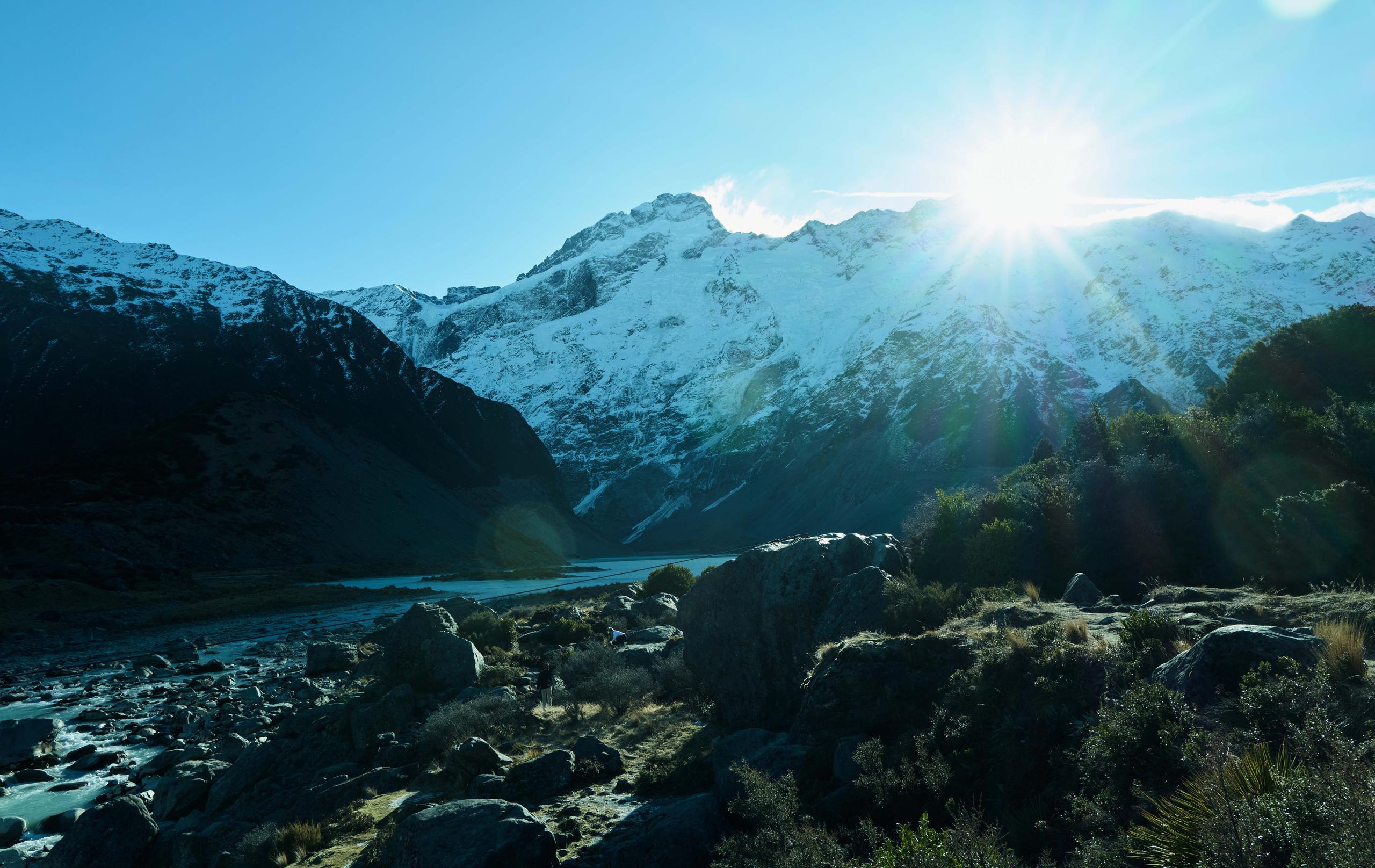 Landscape photo of a rocky lakebed in New Zealand.