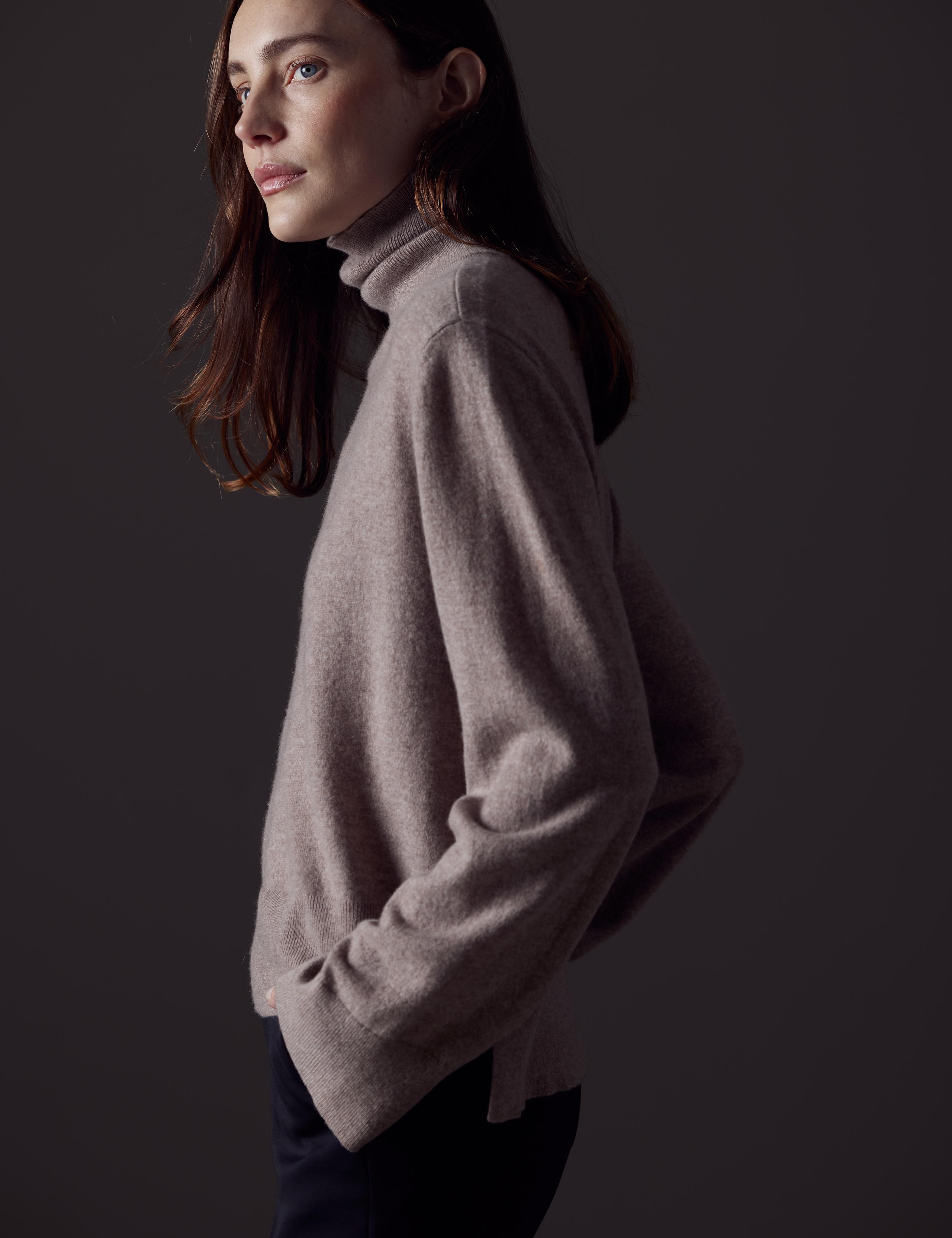 Woman in studio wearing the Leigh Turtleneck Sweater