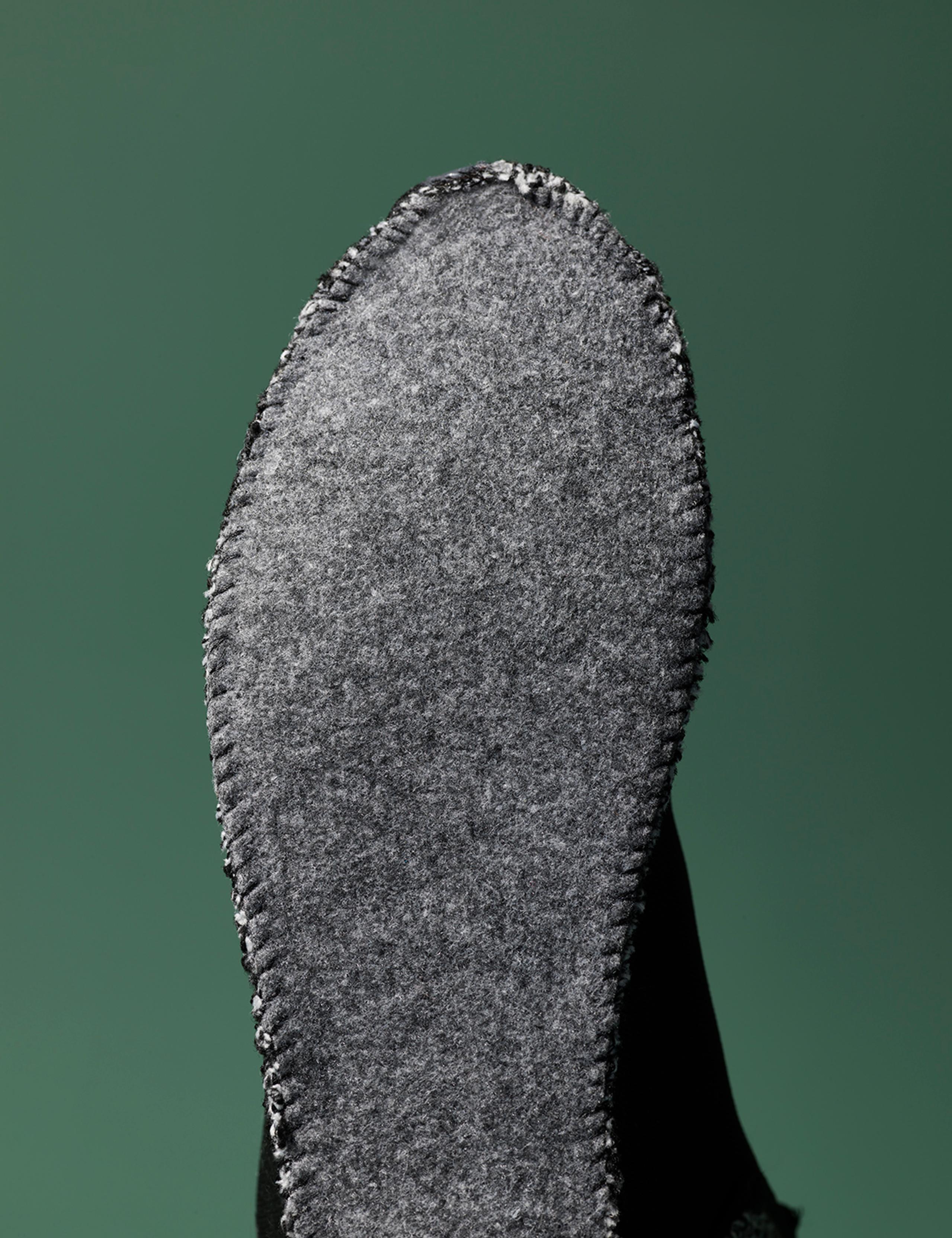 View of felt sole underside of sock bootie
