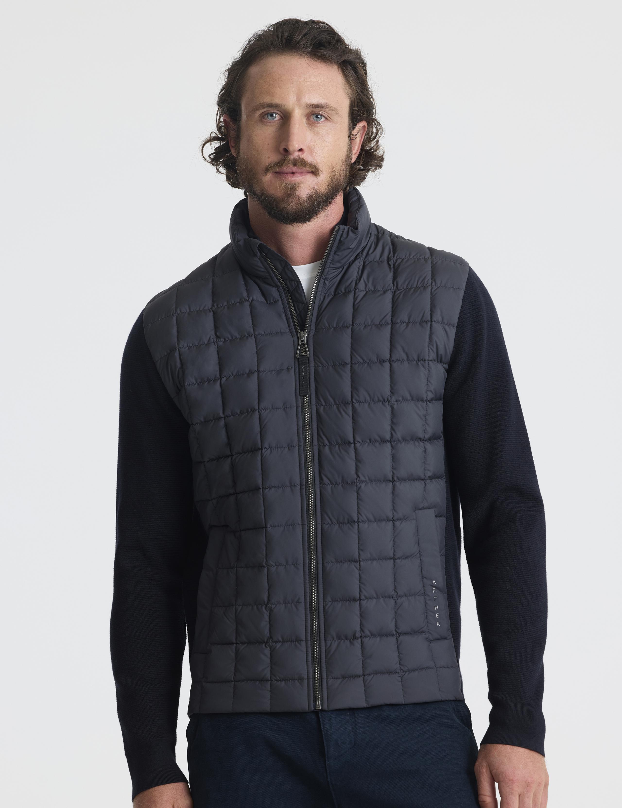 Front view of man wearing Phase Full-Zip in Onyx Black