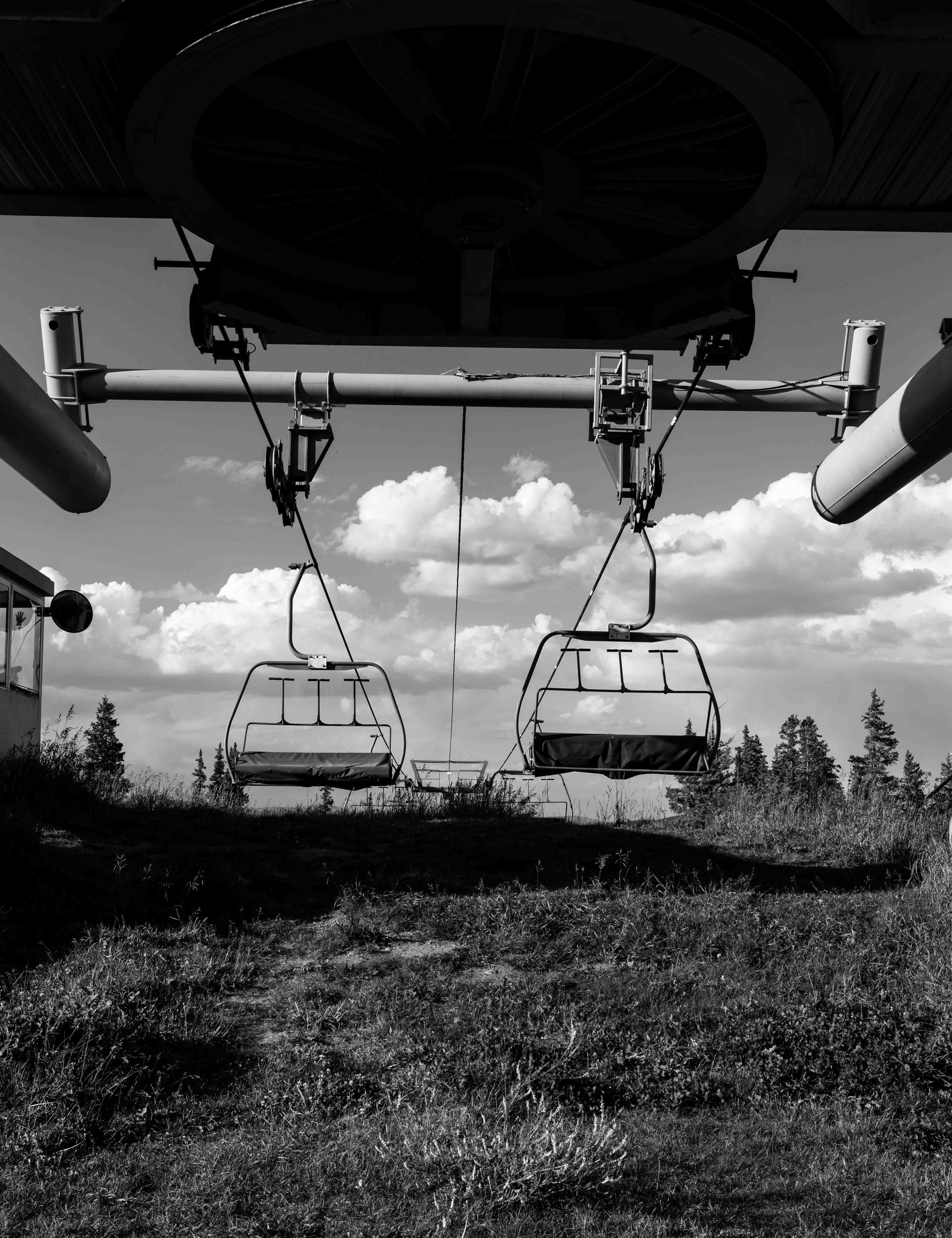 Black and white photograph of empty ski lift in Aspen
