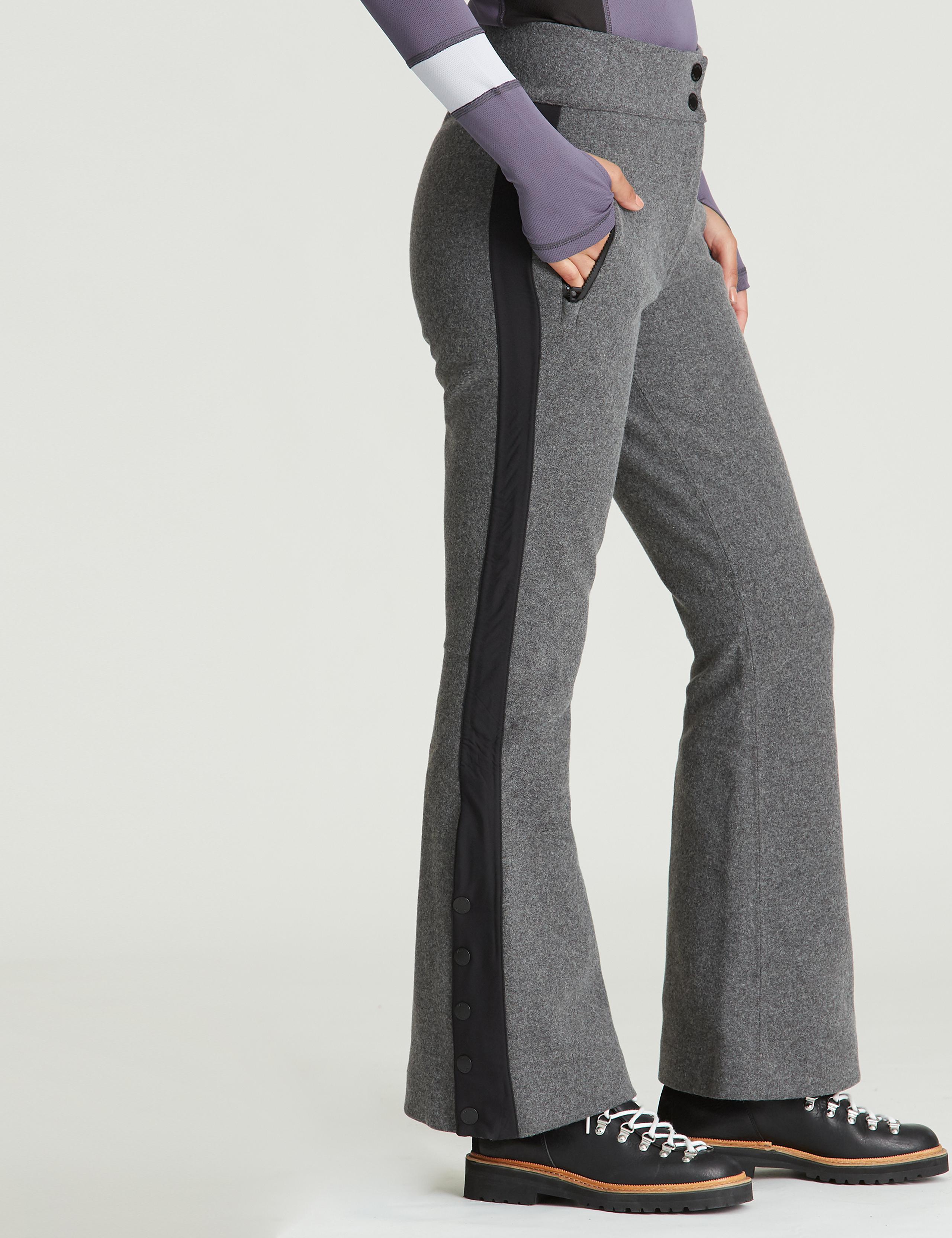 Profile view of woman wearing Victory Wool Snow Pant in studio