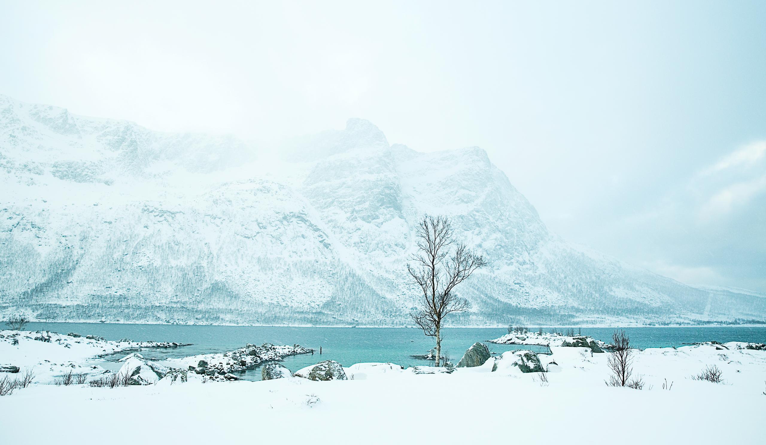 snowy lake and mountain in Norway.