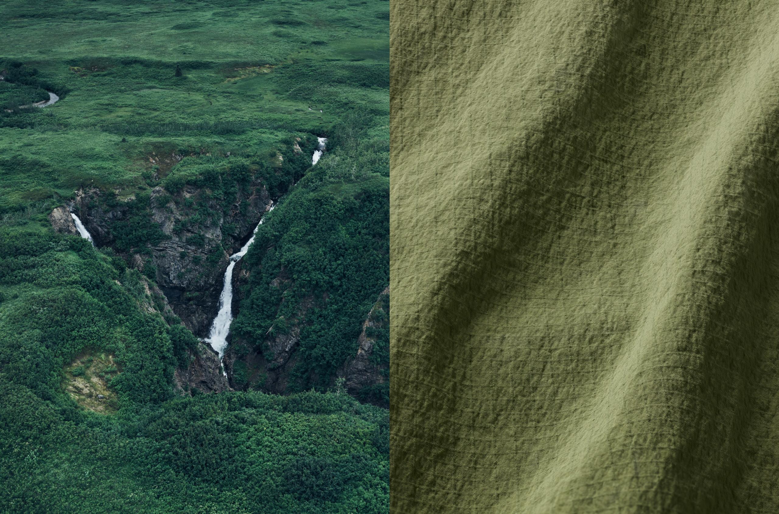 Closeup view of Harrier Anorak fabric juxtaposed next to Alaskan countryside with river