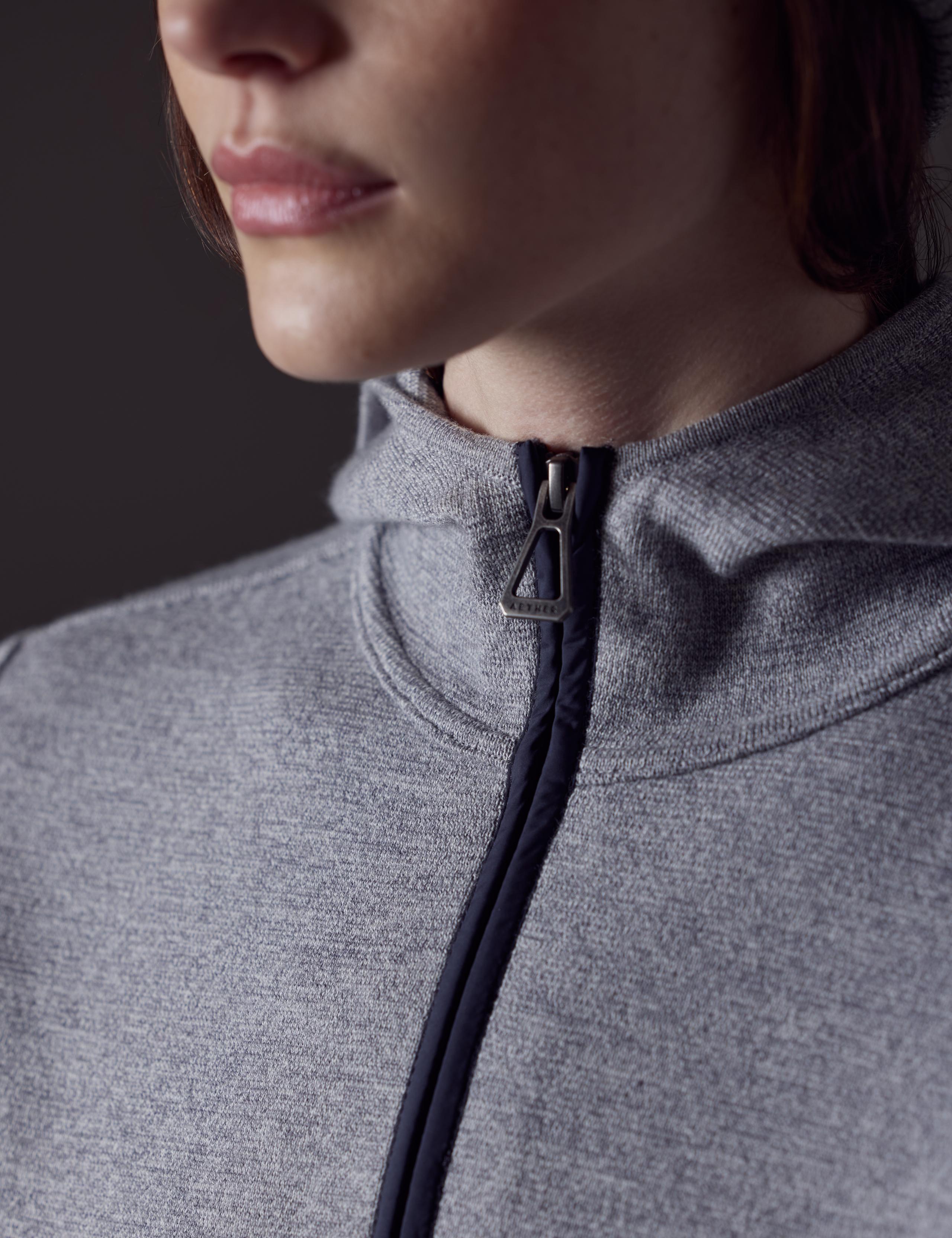 Close-up shot of the W Riley Full-Zip Sweater's zipper.
