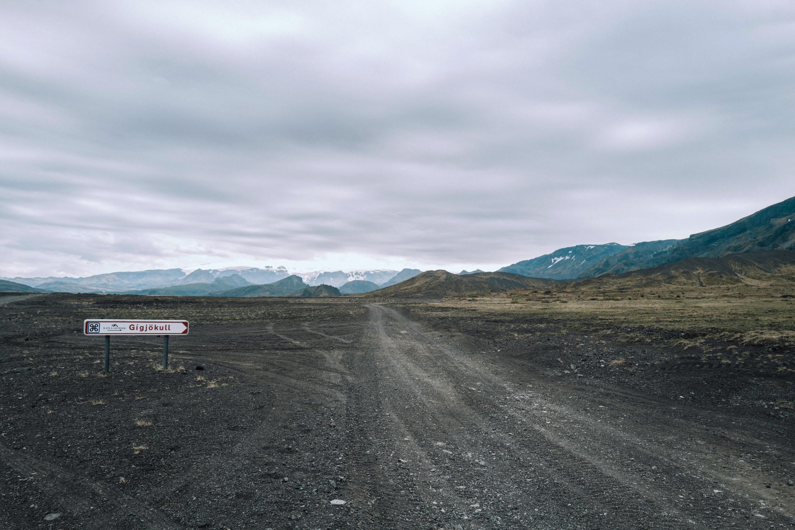 Empty road in Iceland with small sign for Gígjökull