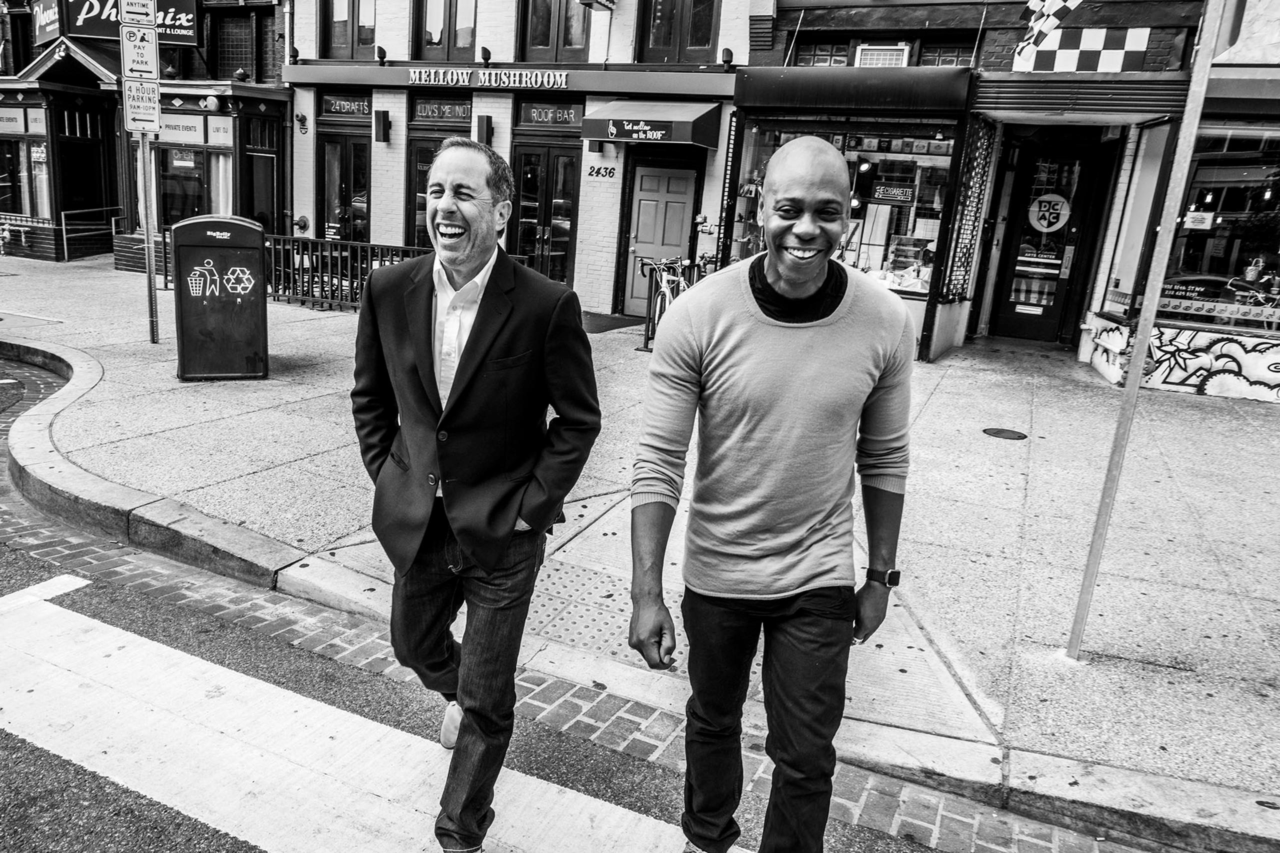 Jerry Seinfeld and Dave Chapelle walking on street, laughing