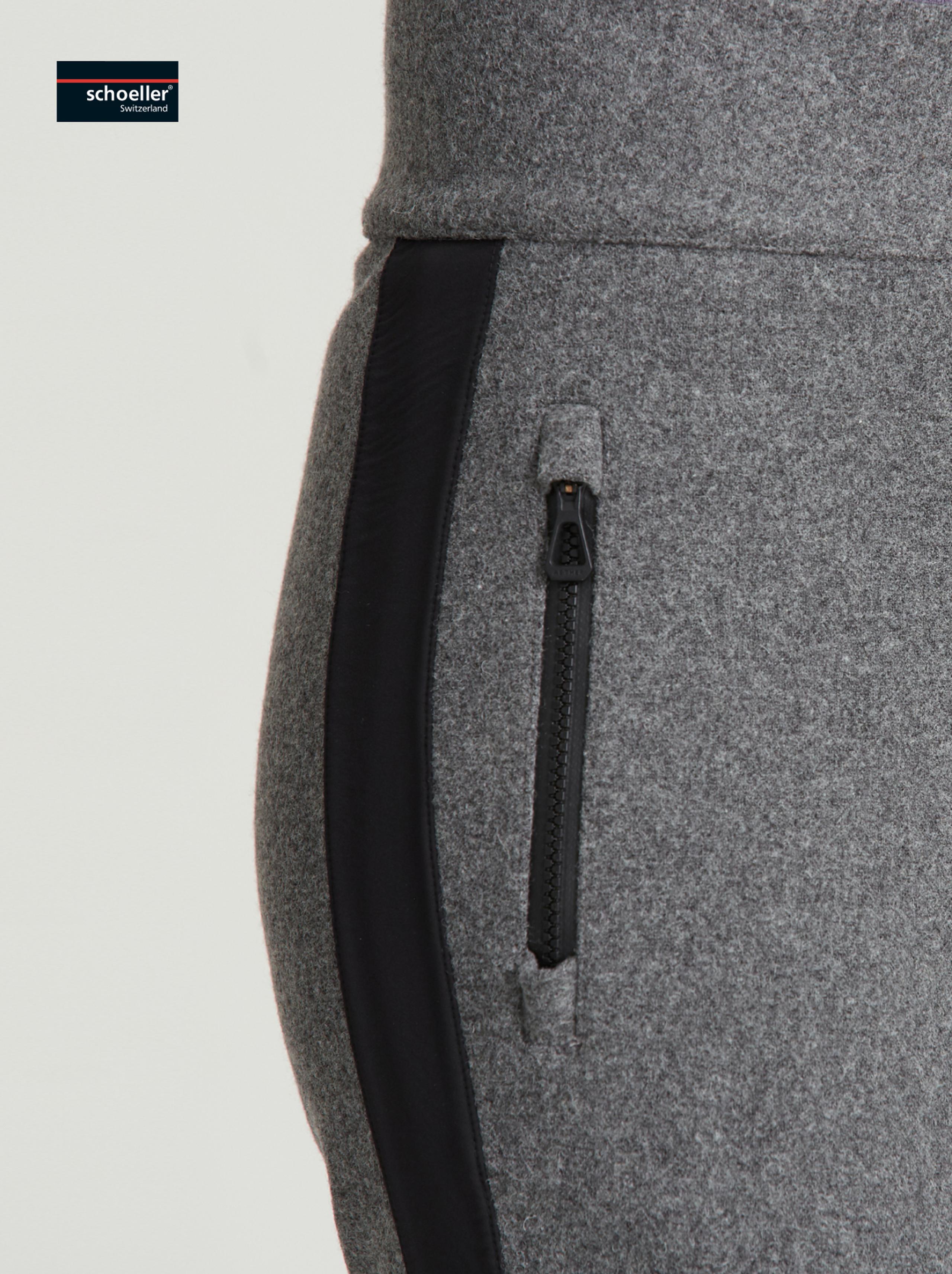 Closeup view of woven side panels and front pocket of Victory Wool Snow Pant