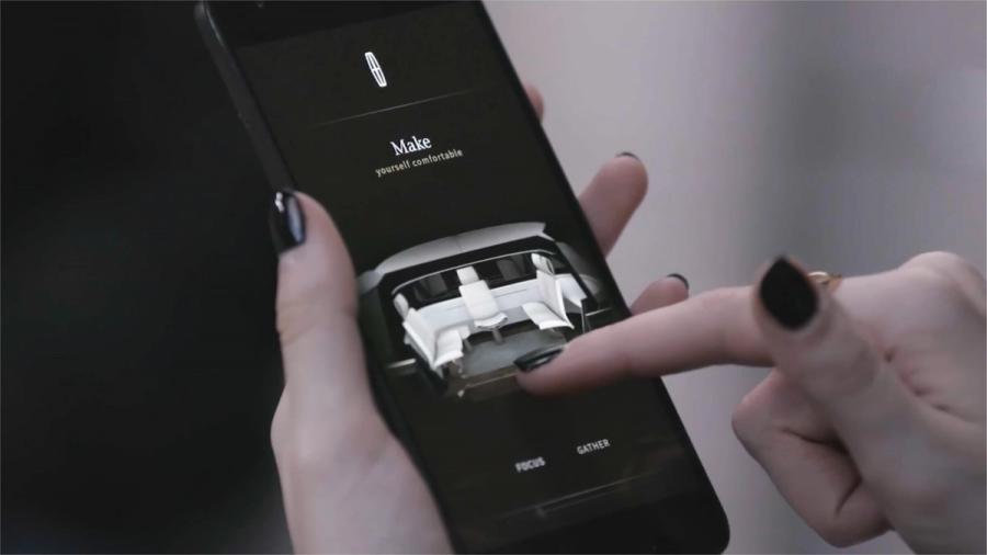 A passenger adjusting their seat from the Ford simulator’s companion app