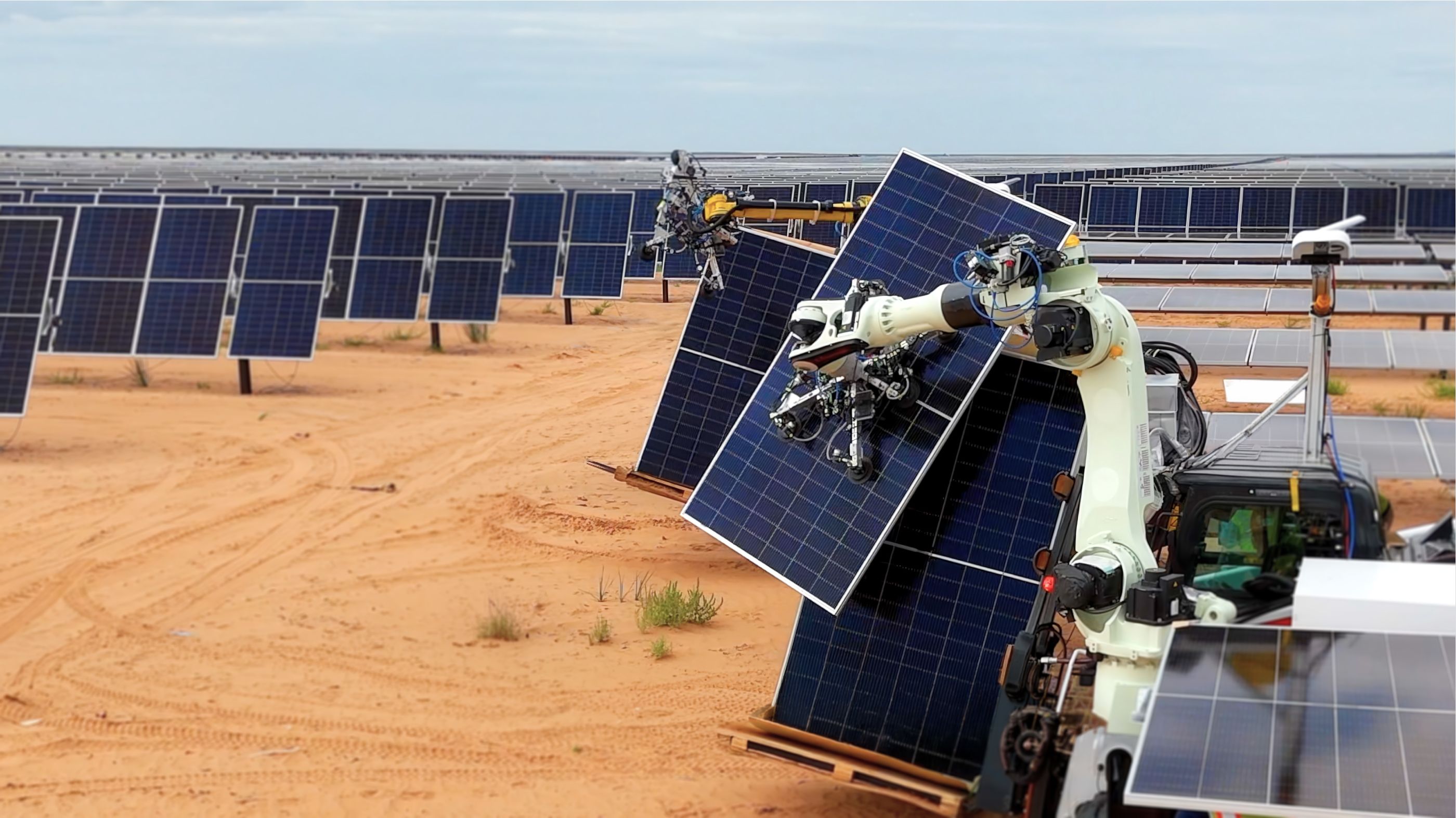 Gritt robots placing solar panels on a desert solar farm
