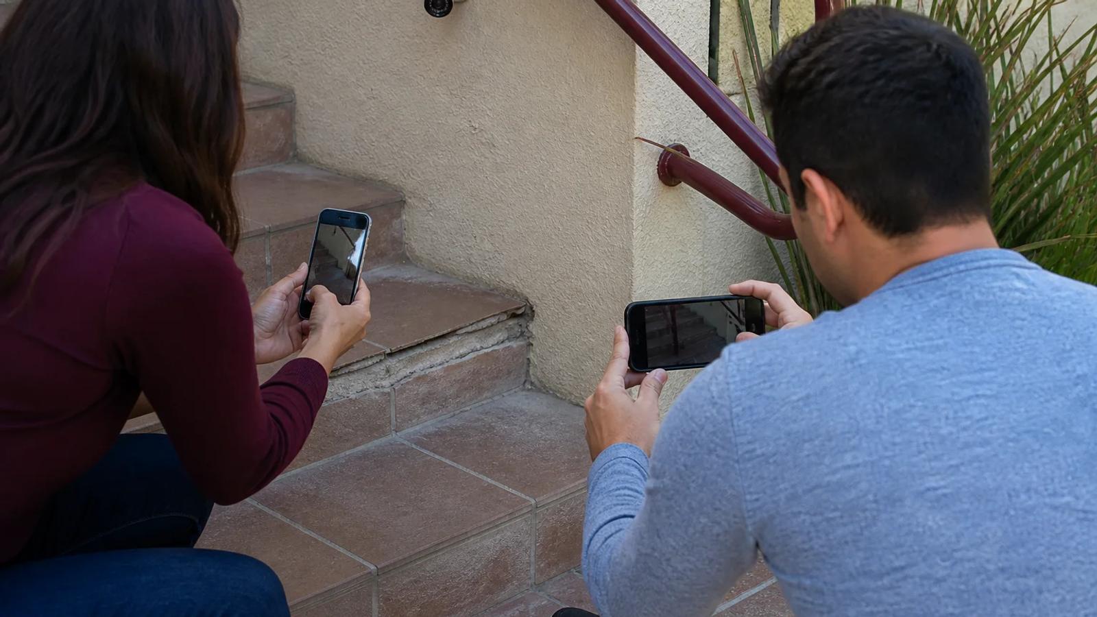A family member safely photographing an accident location while organizing witness, medical, and damaged-property records