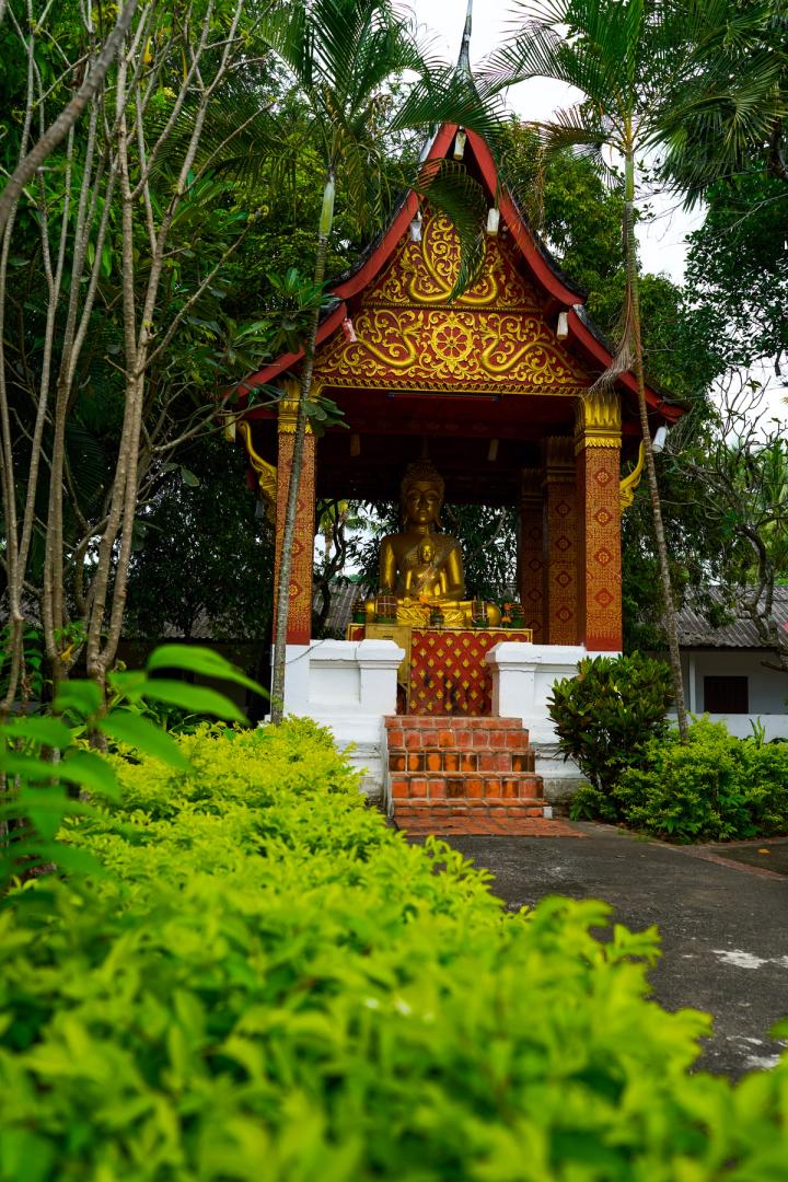 a small golden temple in luang prabang, laos