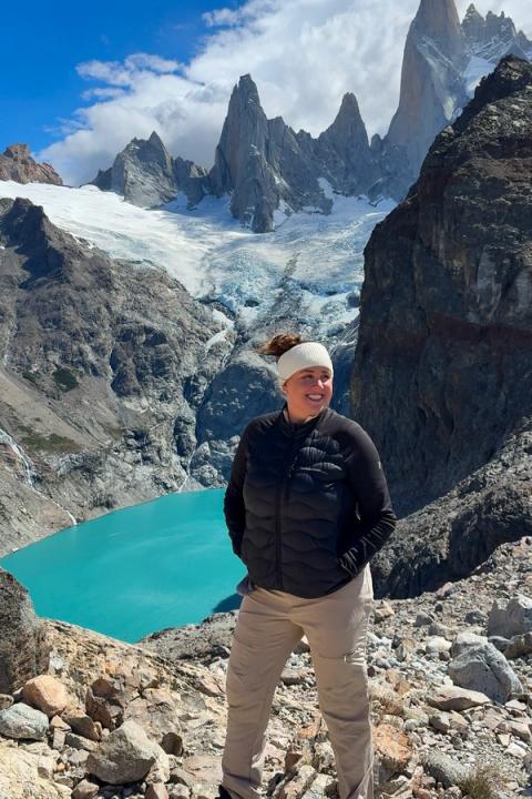 woman standing in front of laguna sucia in el chalten, argentina